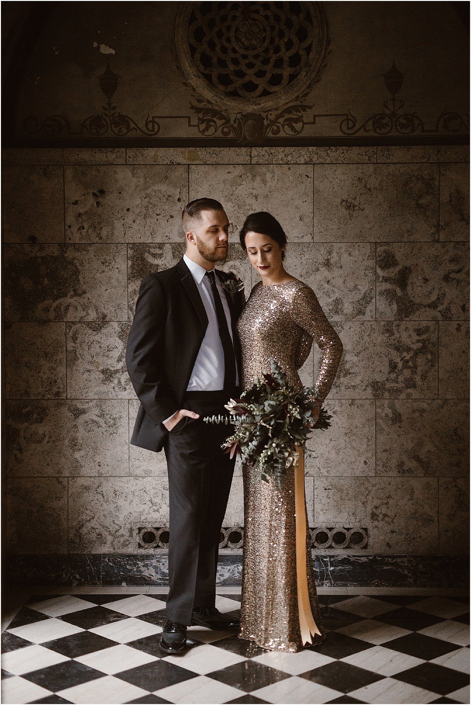wedding couple photos for black and gold wedding with sequin dress and moody buquet