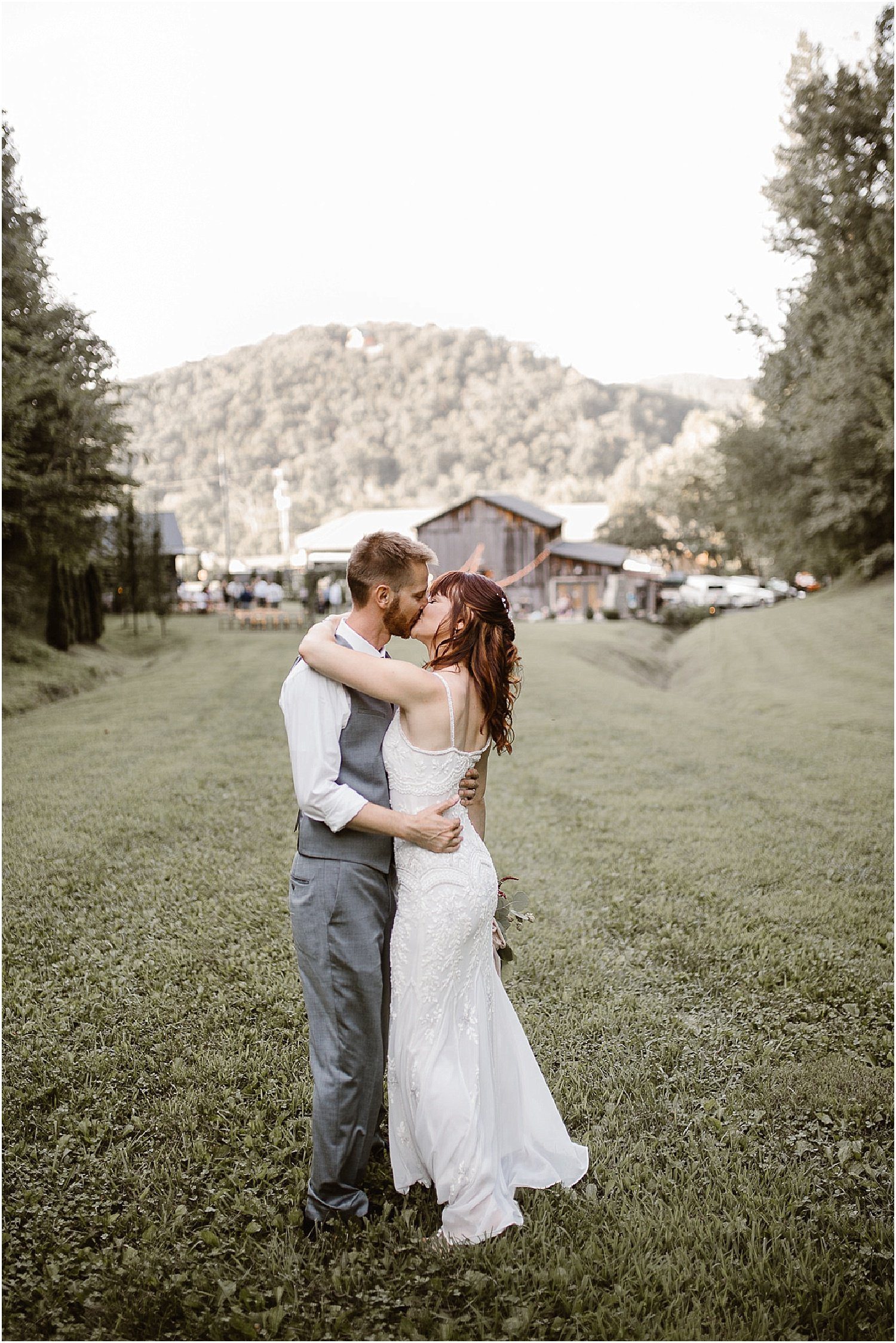 Bride and Groom Kiss on Wedding Day at The Barn at Chestnut Springs