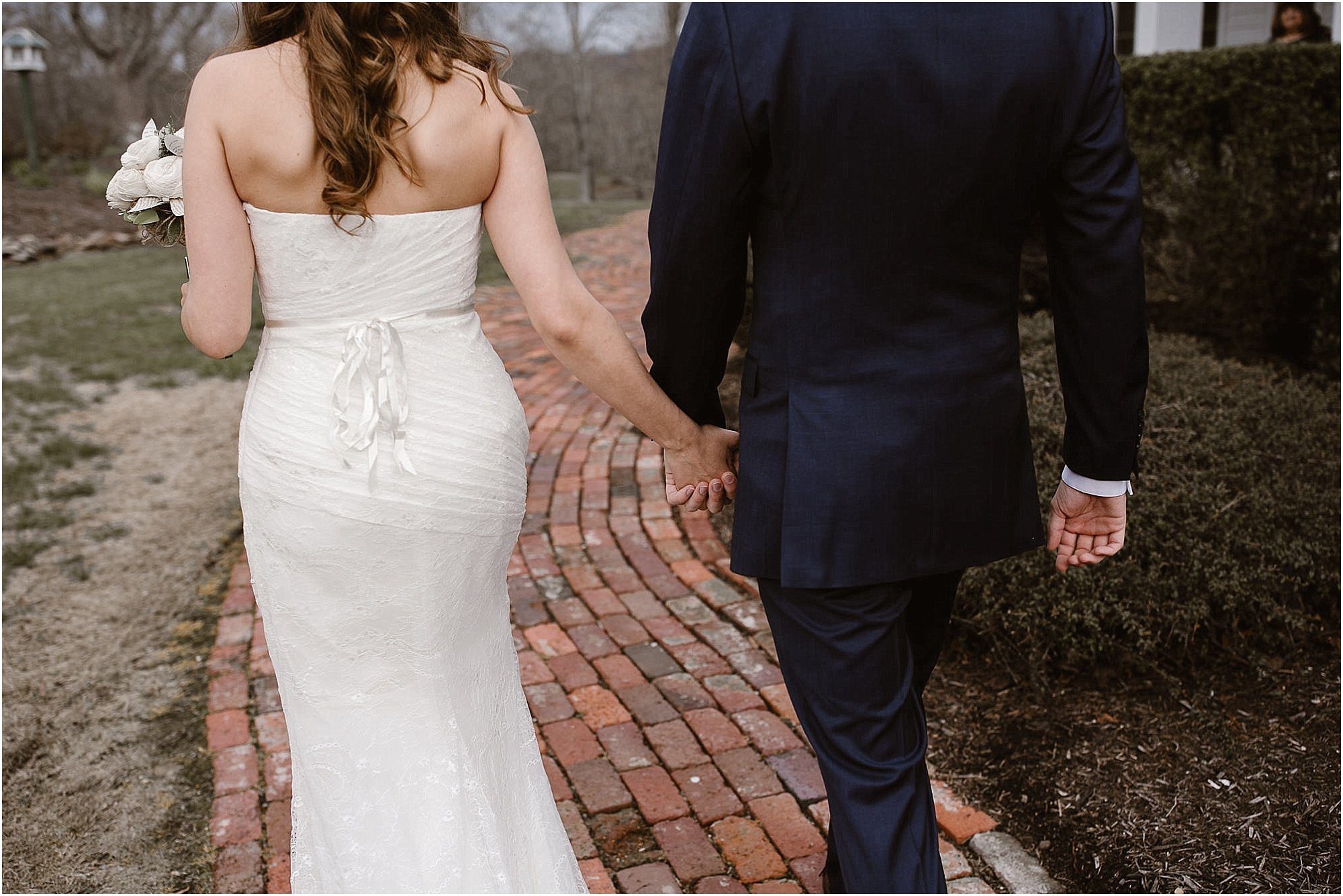 Holding hands and walking at Whitestone Inn Wedding