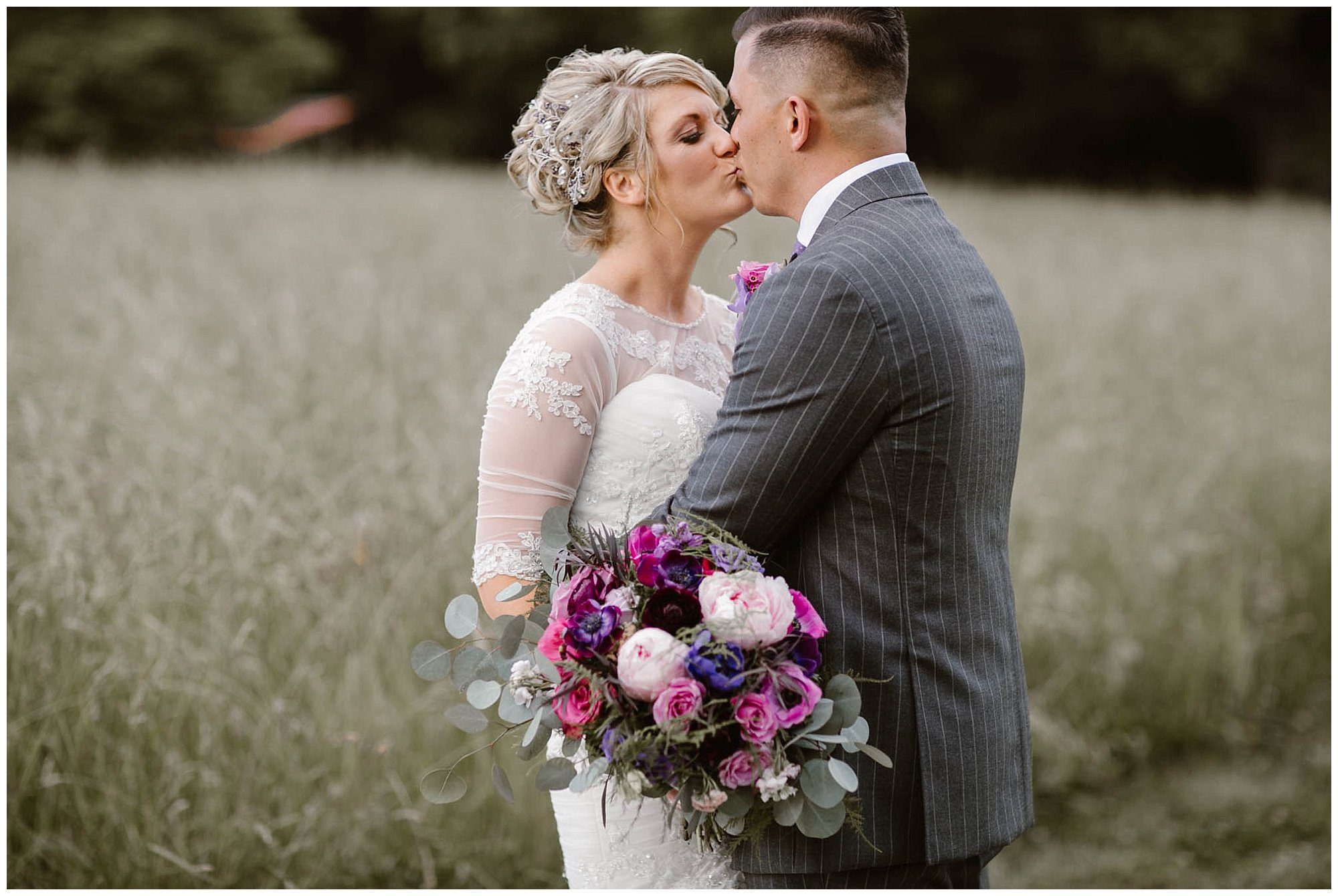 Bride and groom kissing at Heartland Meadows