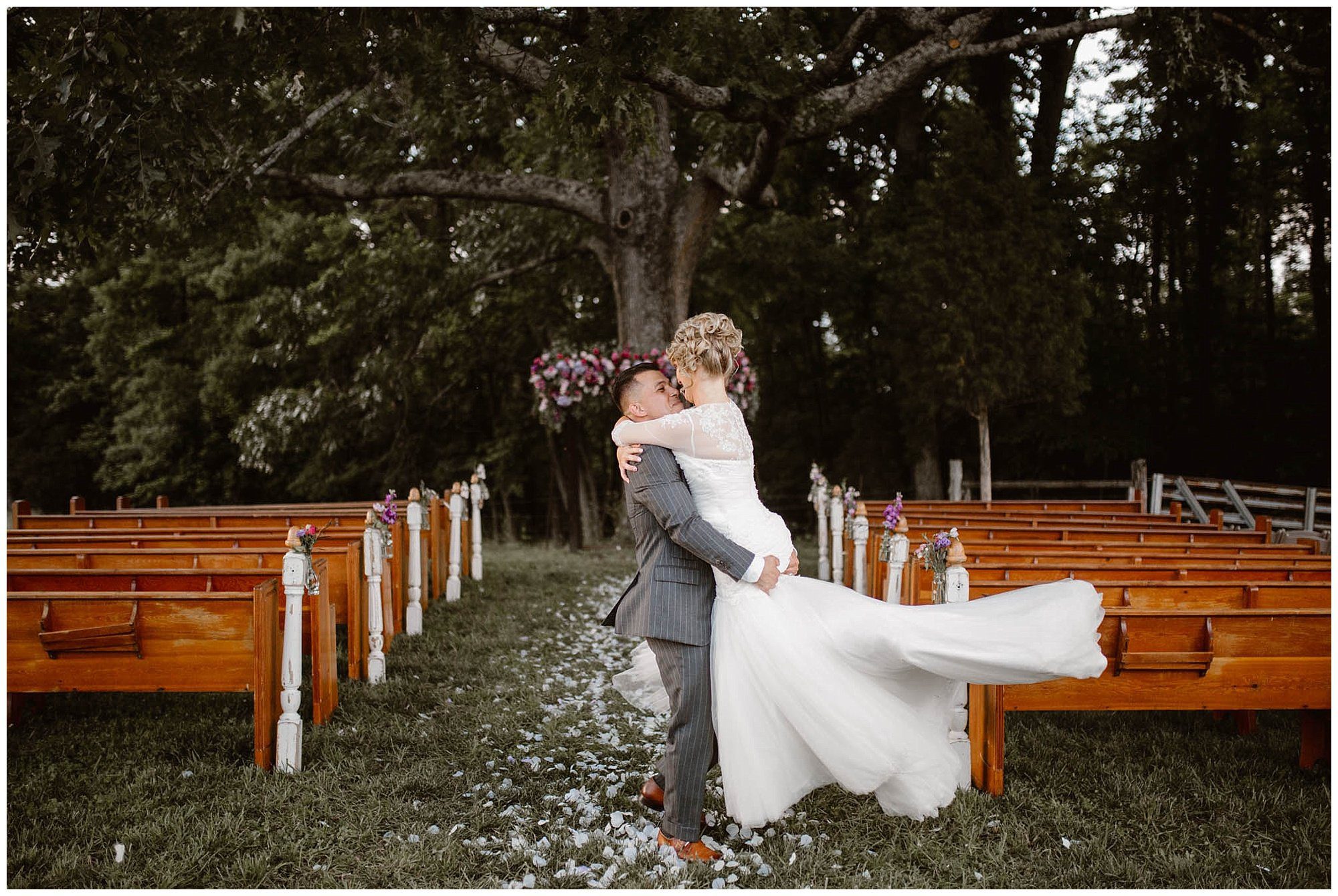Bride and groom embrace at Heartland Meadows Wedding