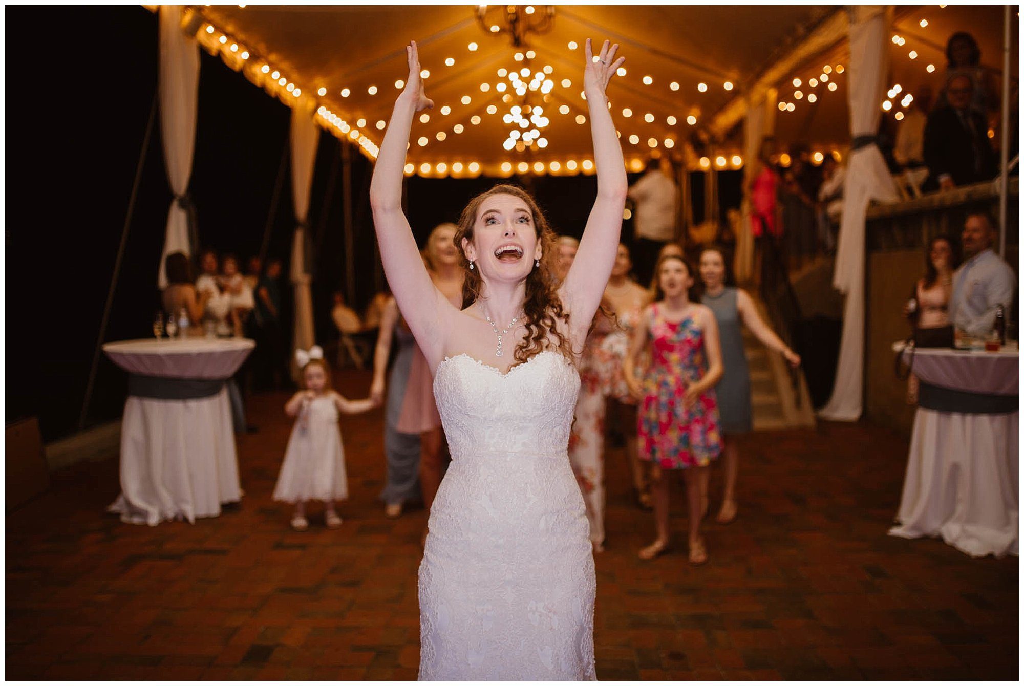 Bride tossing bouquet at Crescent Bend House Wedding Knoxville