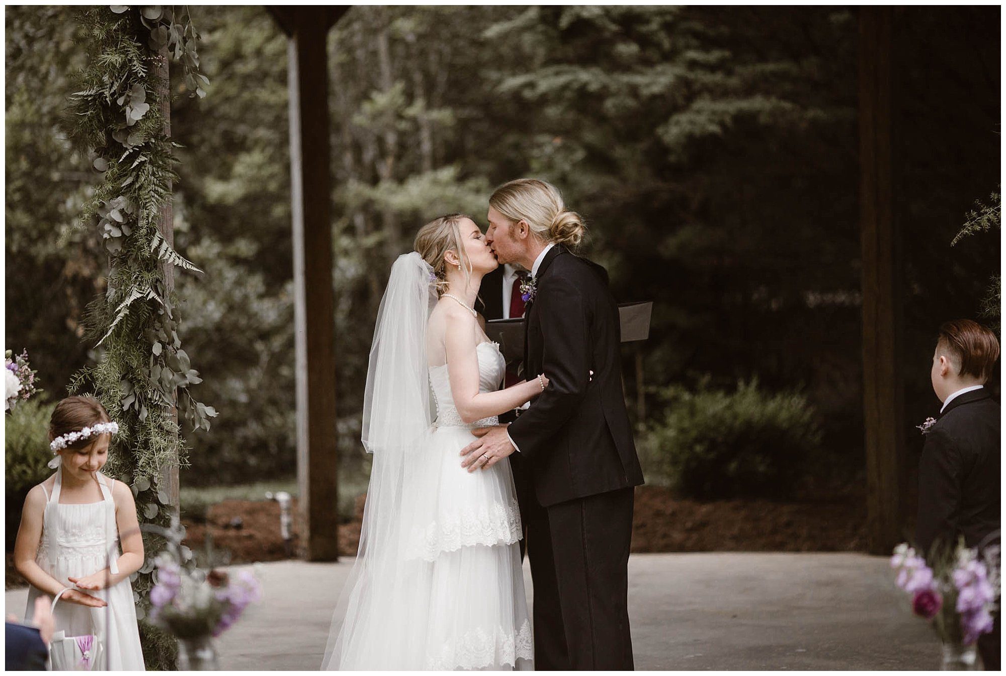 First kiss at wedding in Townsend Mountain Wedding Venue