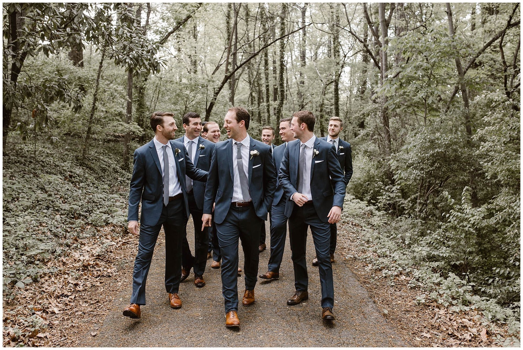 groom and groomsmen walking on greenway in Knoxville