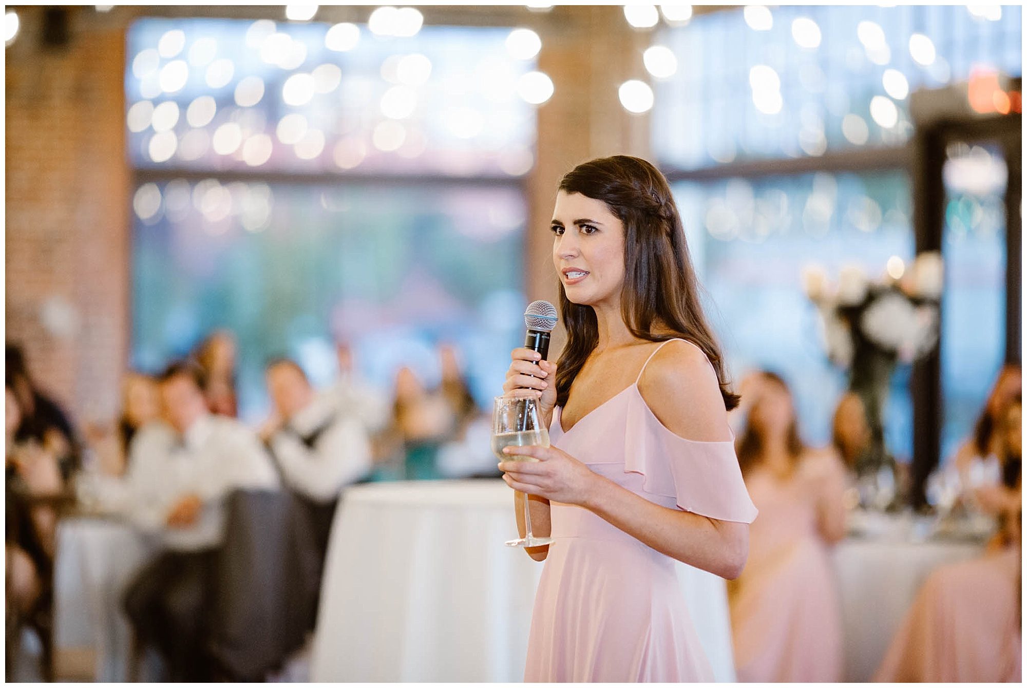 bridesmaid giving toast at wedding