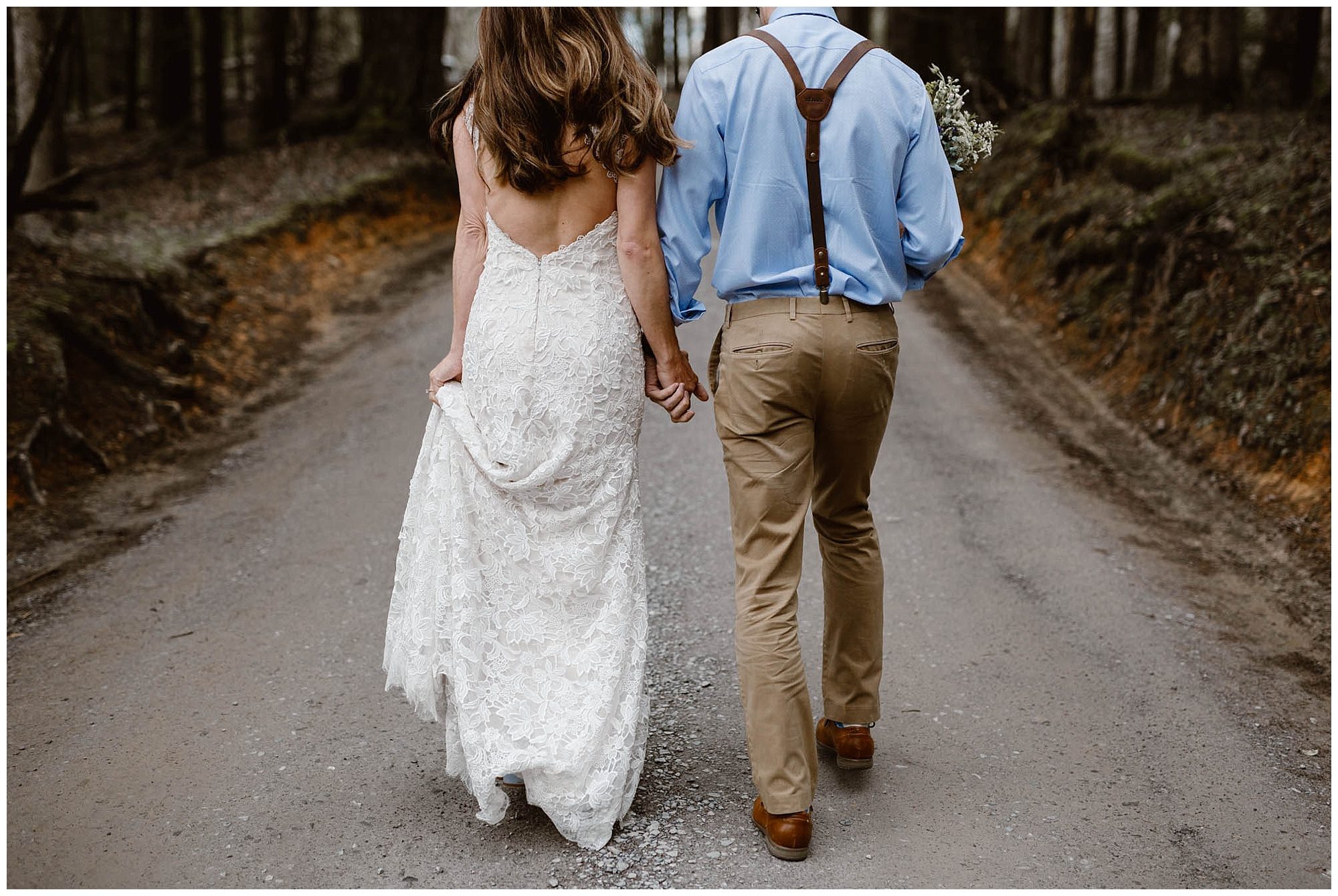bride and groom walking on gravel road