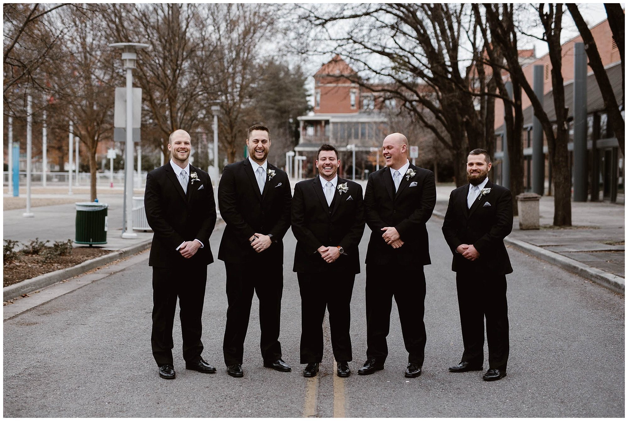 groom and groomsmen photos on street in Knoxville