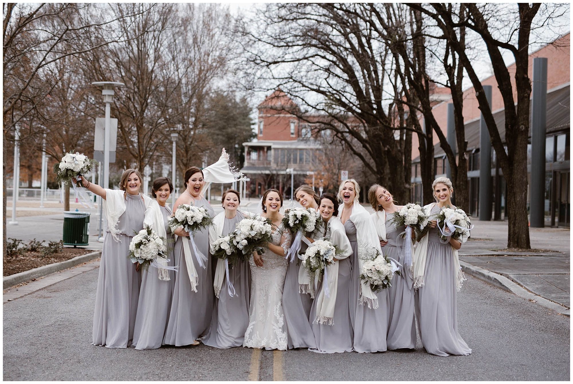 bride and bridesmaid photos on street in Knoxville on wedding day