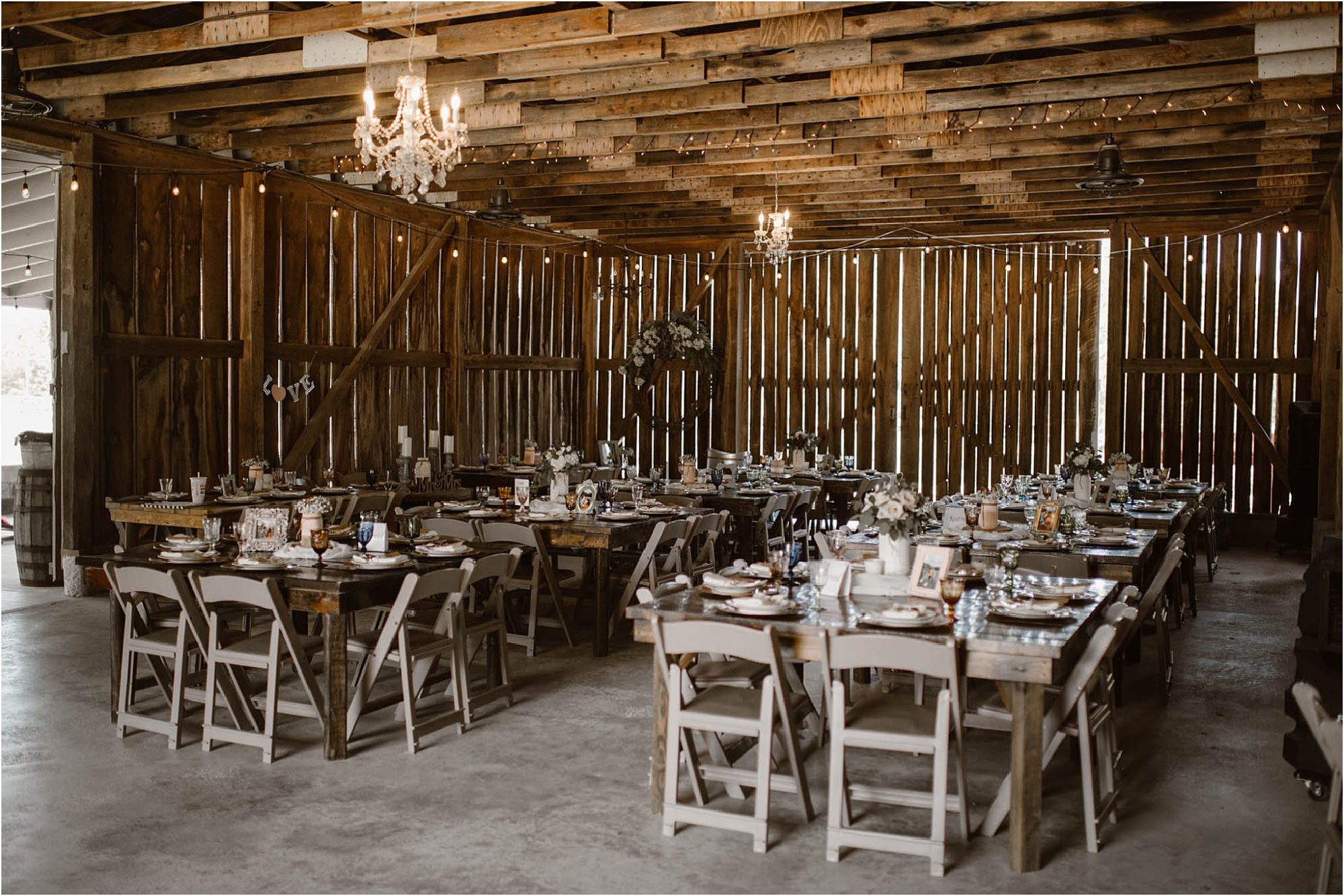 tables in barn at rustic barn wedding
