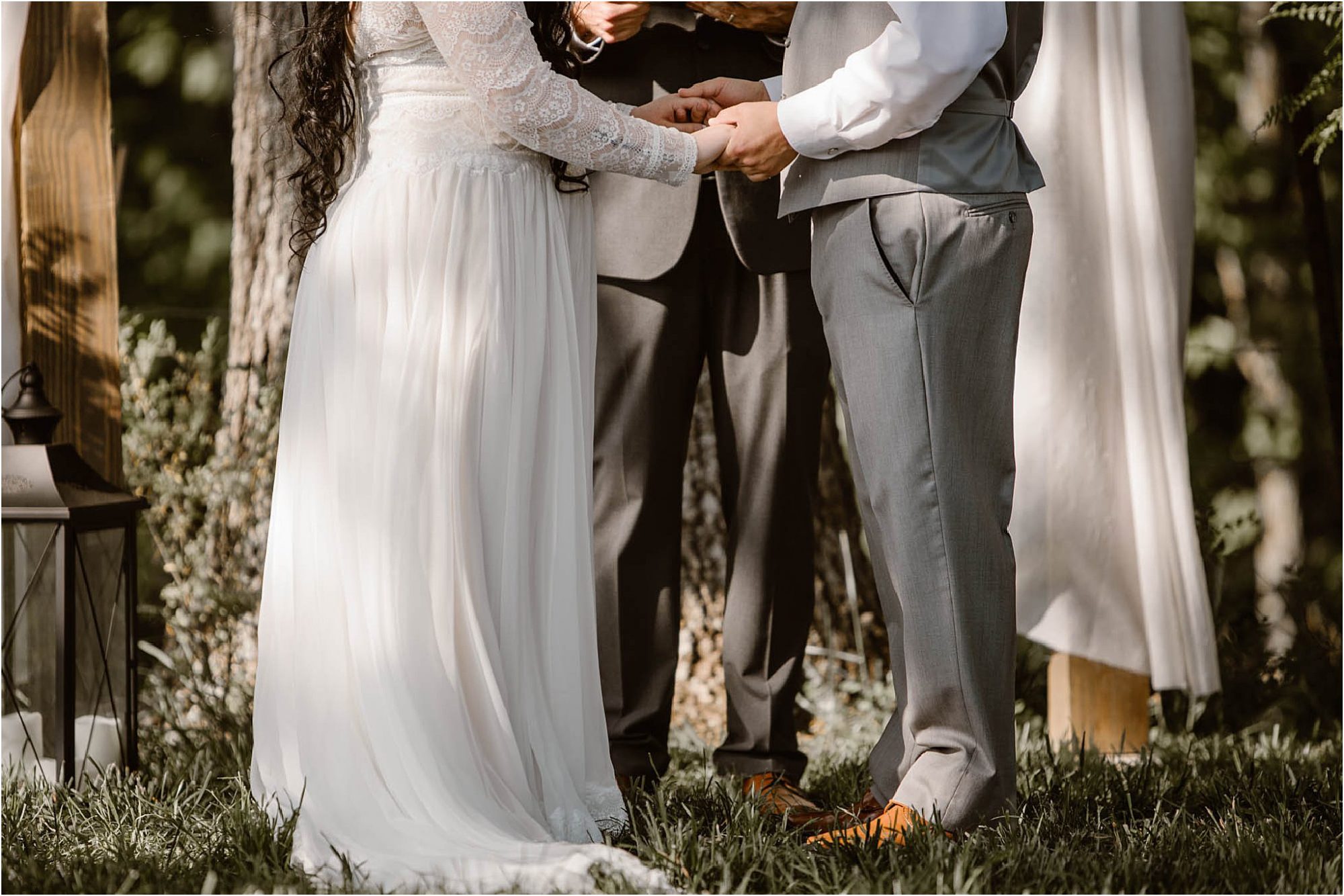 bride and groom holding hands at wedding ceremony