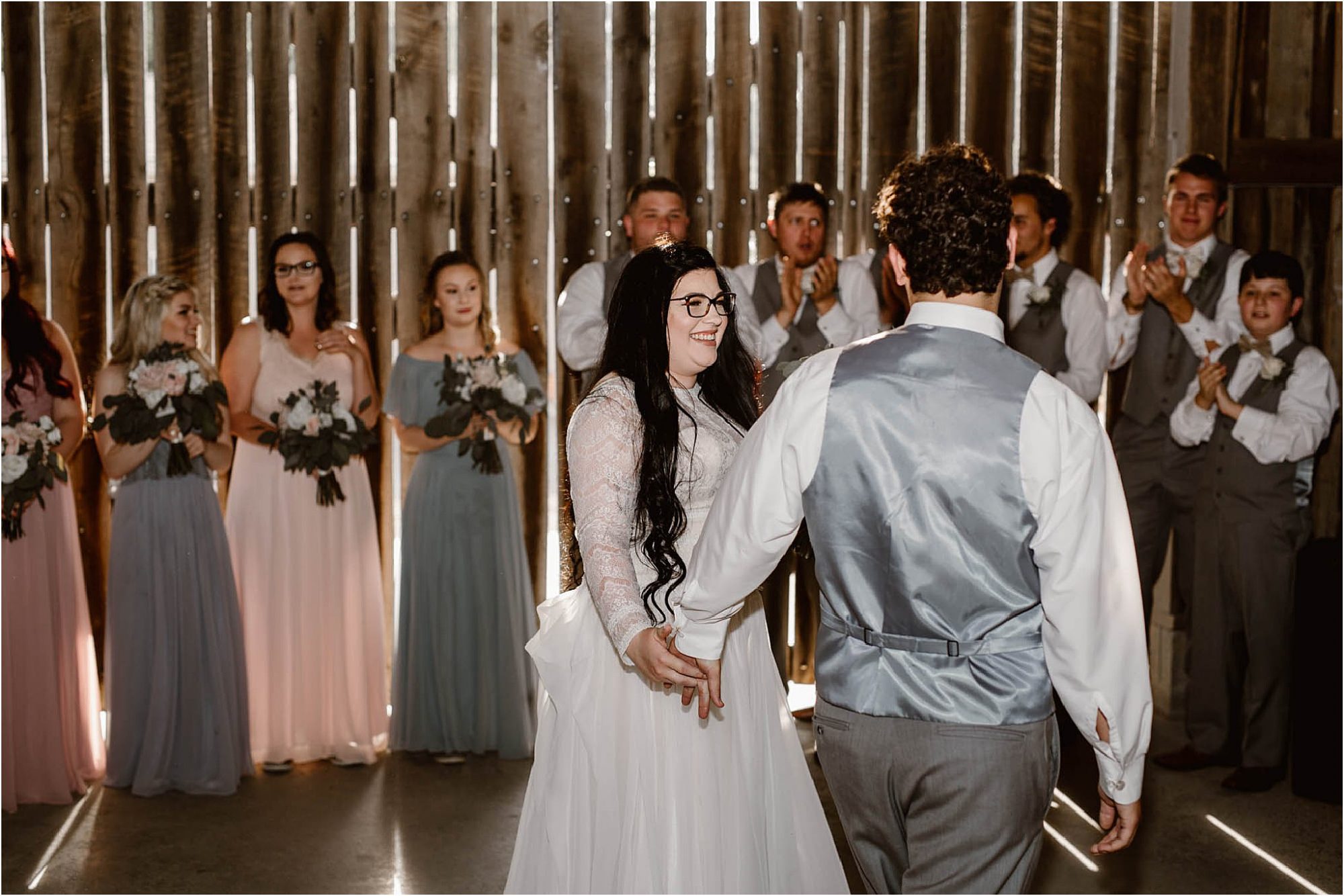 bride and groom enter reception at Heartland Meadows
