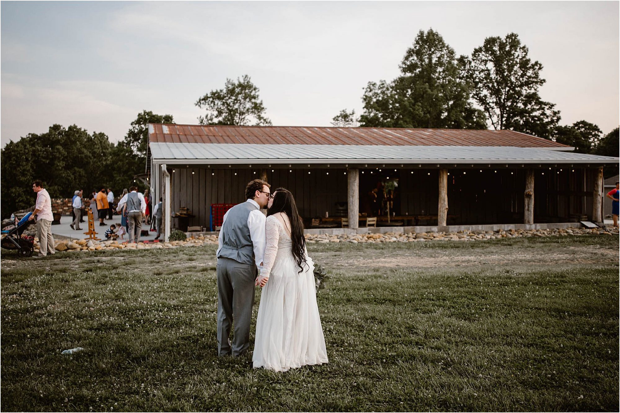 bride and groom kissing at Heartland Meadows Wedding Venue