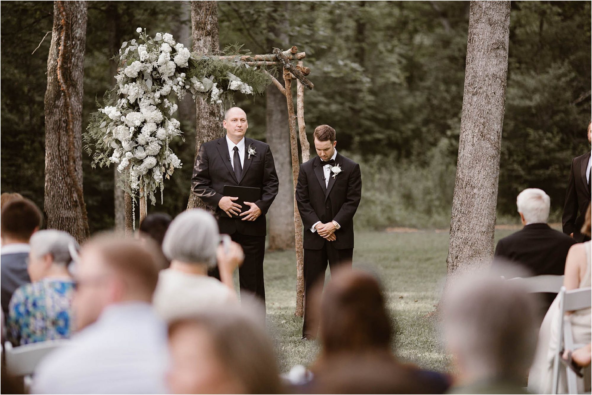 groom at ceremony waiting on bride to walk down aisle