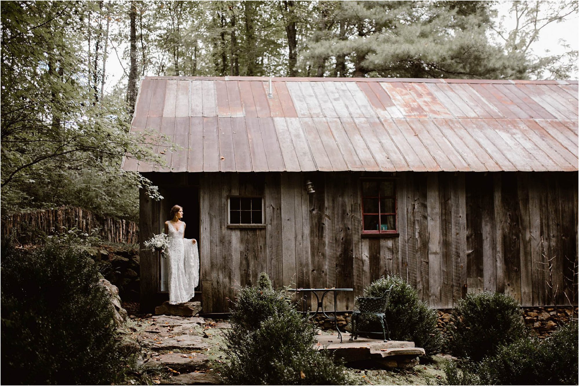bride standing in doorway of lodge at The Vineyards at Betty's Creek