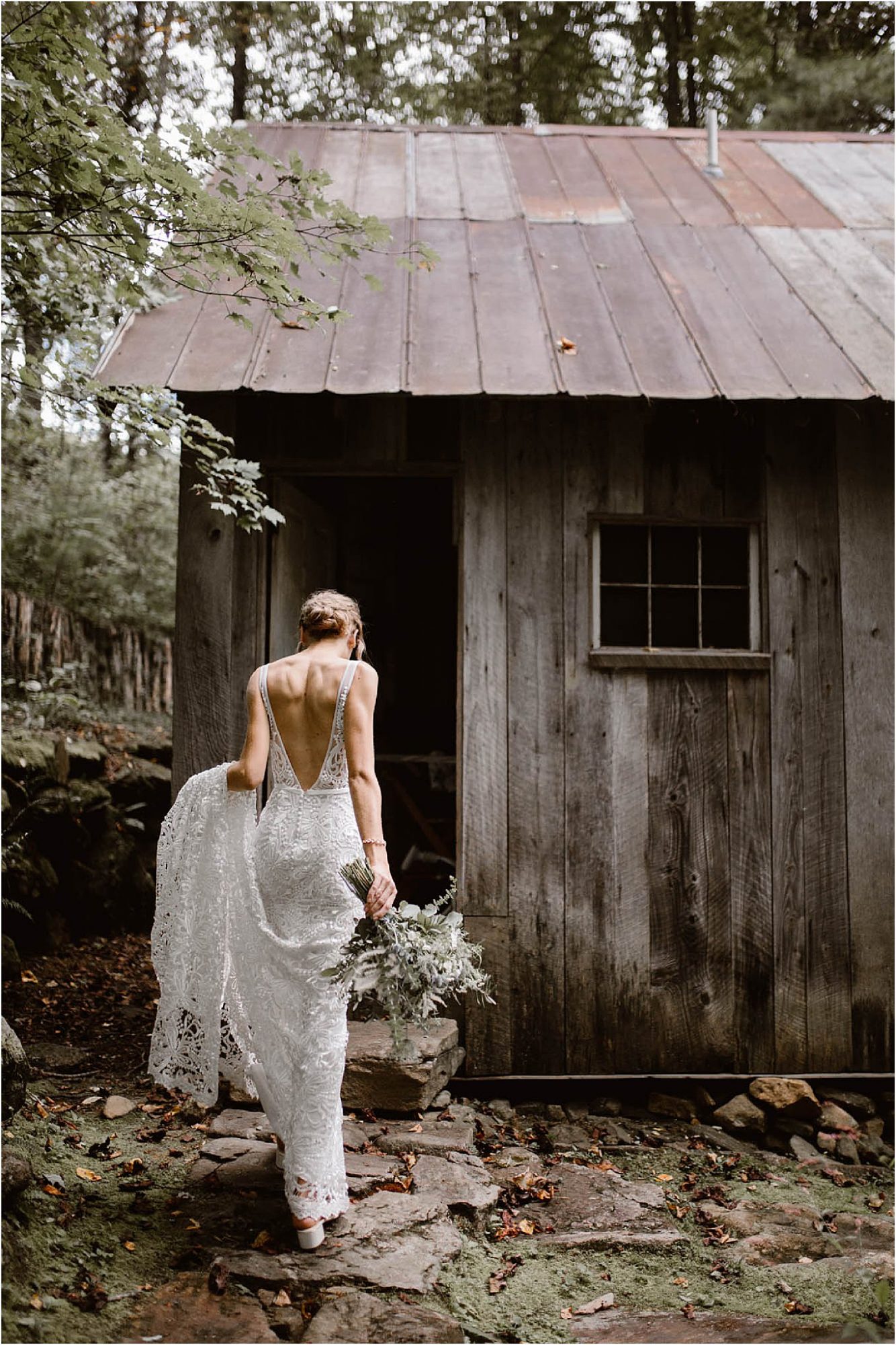 bride walking into cabin on wedding day