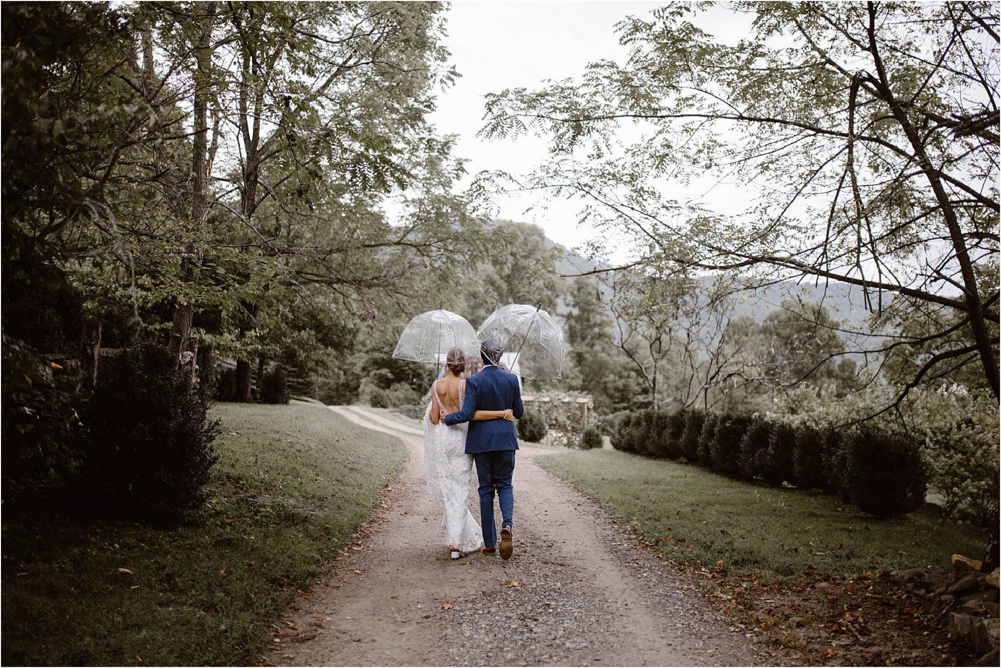 bride and groom walking with arms around each other at North Carolina Vineyard