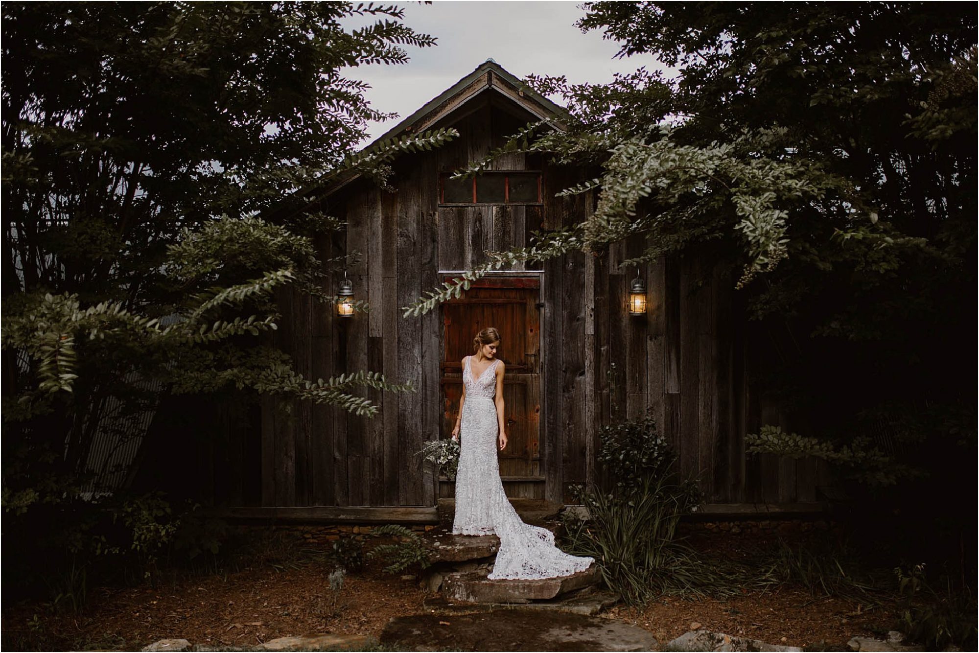 bride standing in front of groom's lodge at North Carolina Vineyard