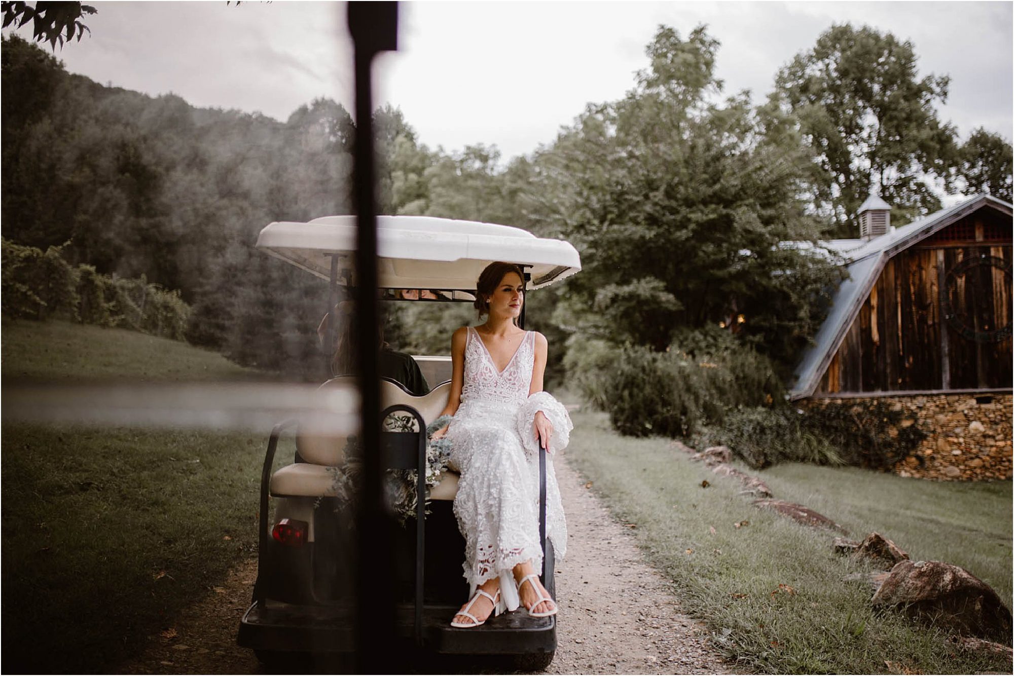 bride riding in golf cart at The Vineyards at Betty's Creek