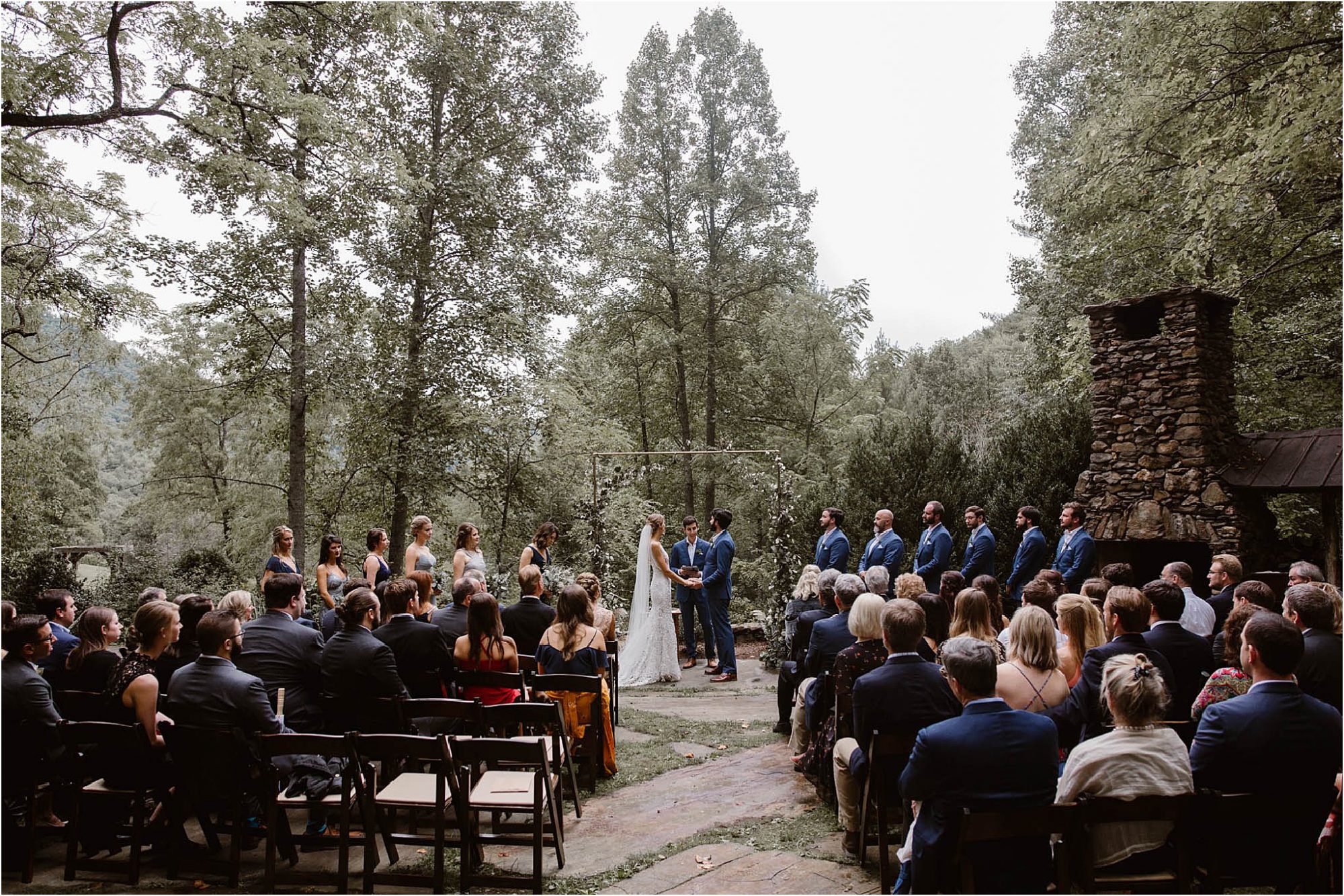 wedding ceremony in courtyard of Honeymoon Lodge at North Carolina Vineyard