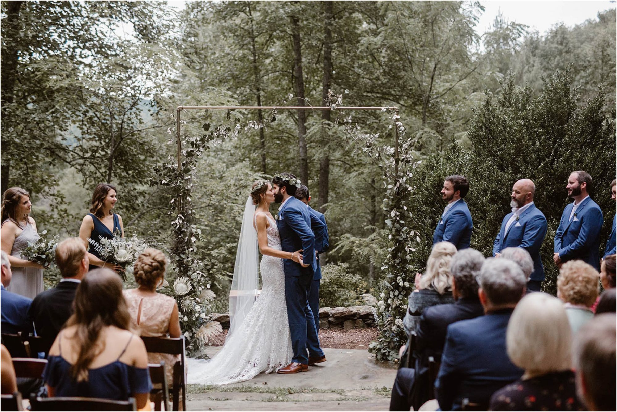 first kiss at altar at North Carolina Vineyards wedding