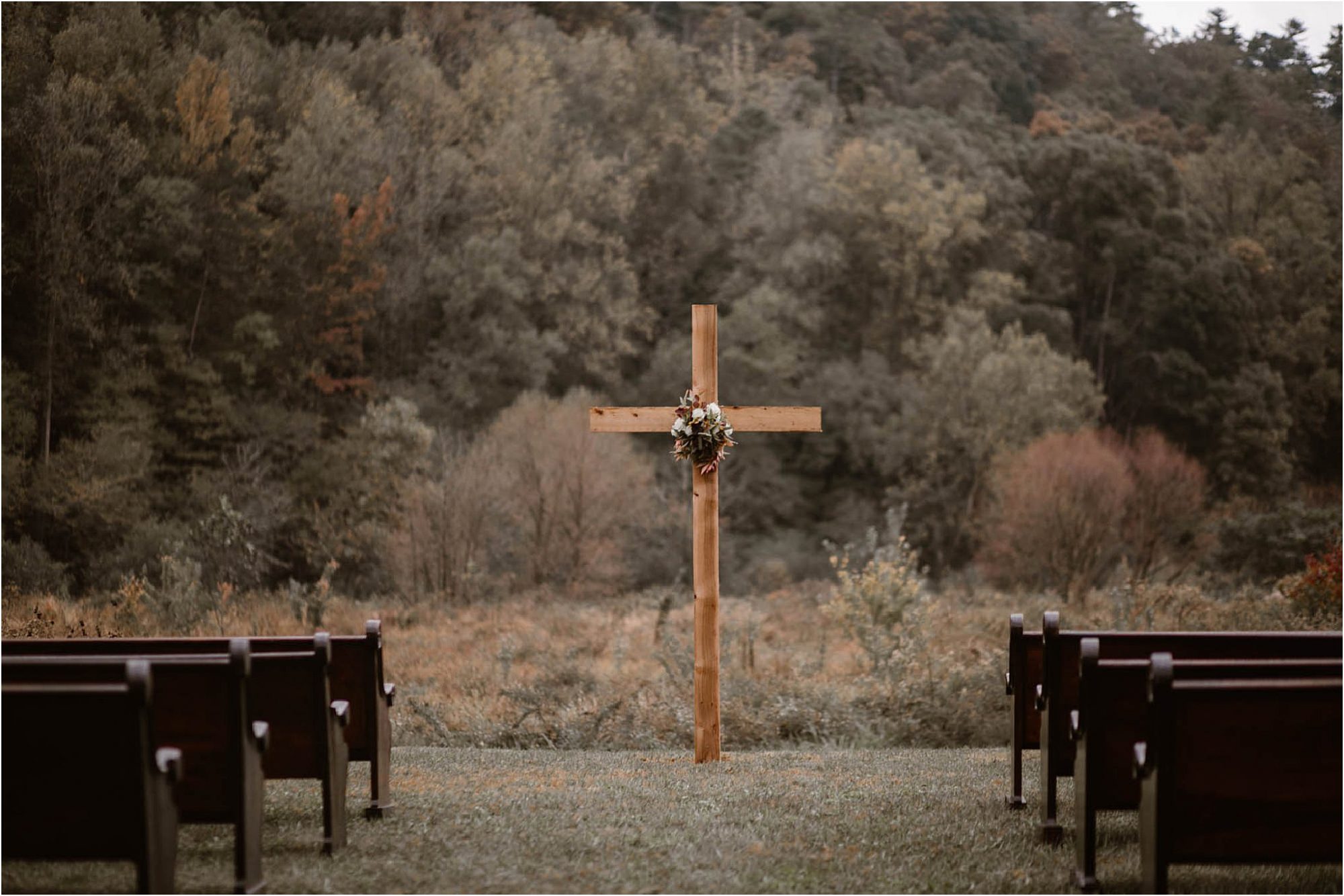 wooden cross at mountain wedding