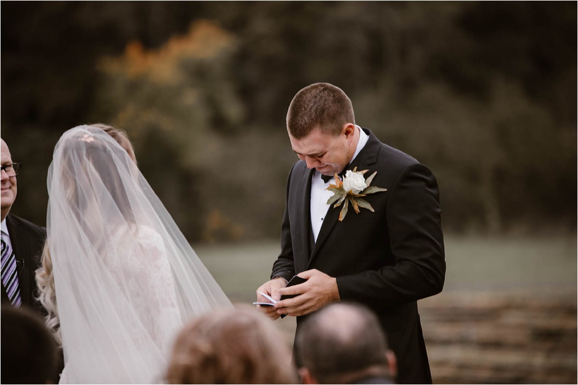 groom crying while reading vows at Mountain Wedding in Tennessee