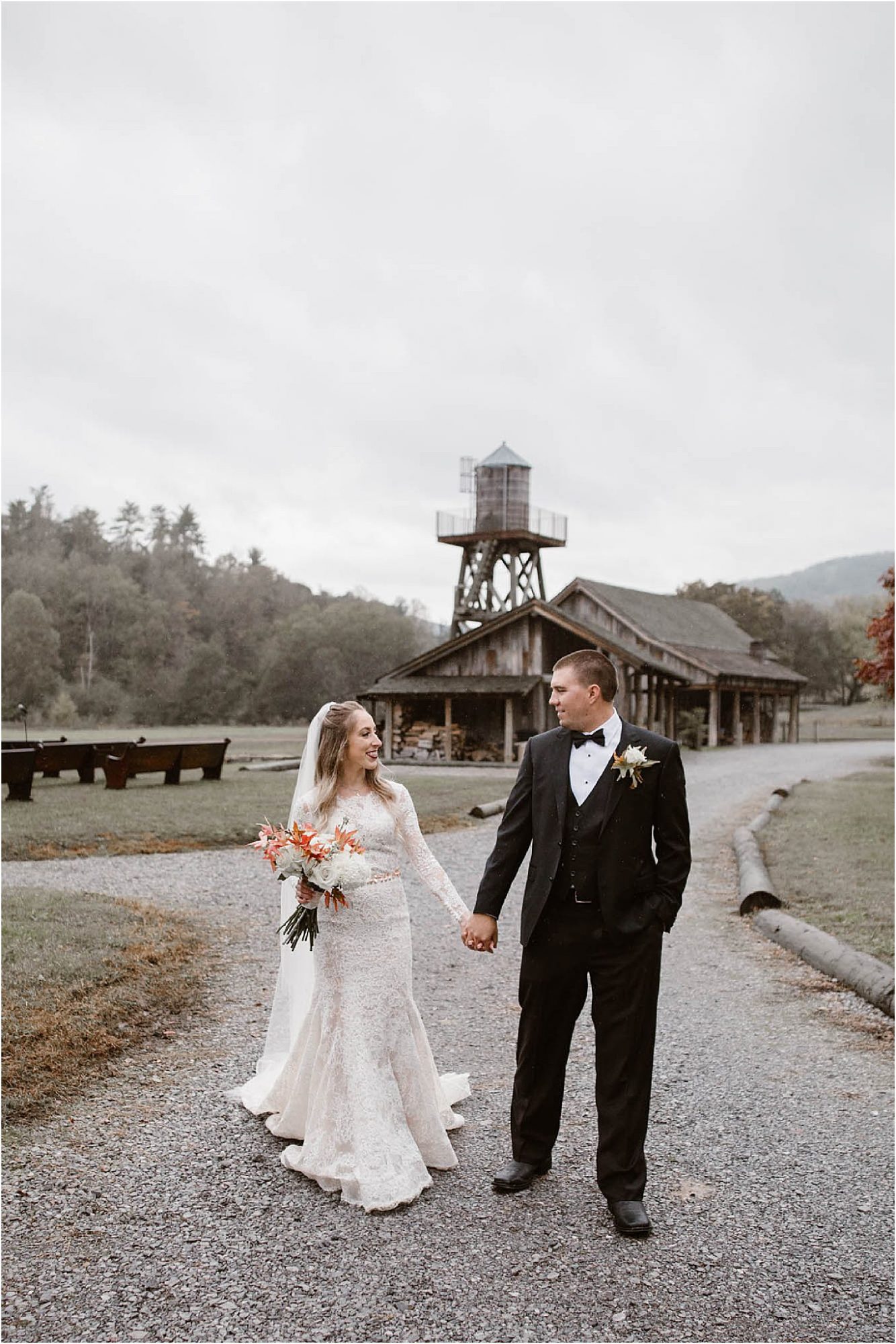 bride and groom hold hands while walking at Pure Water Farm
