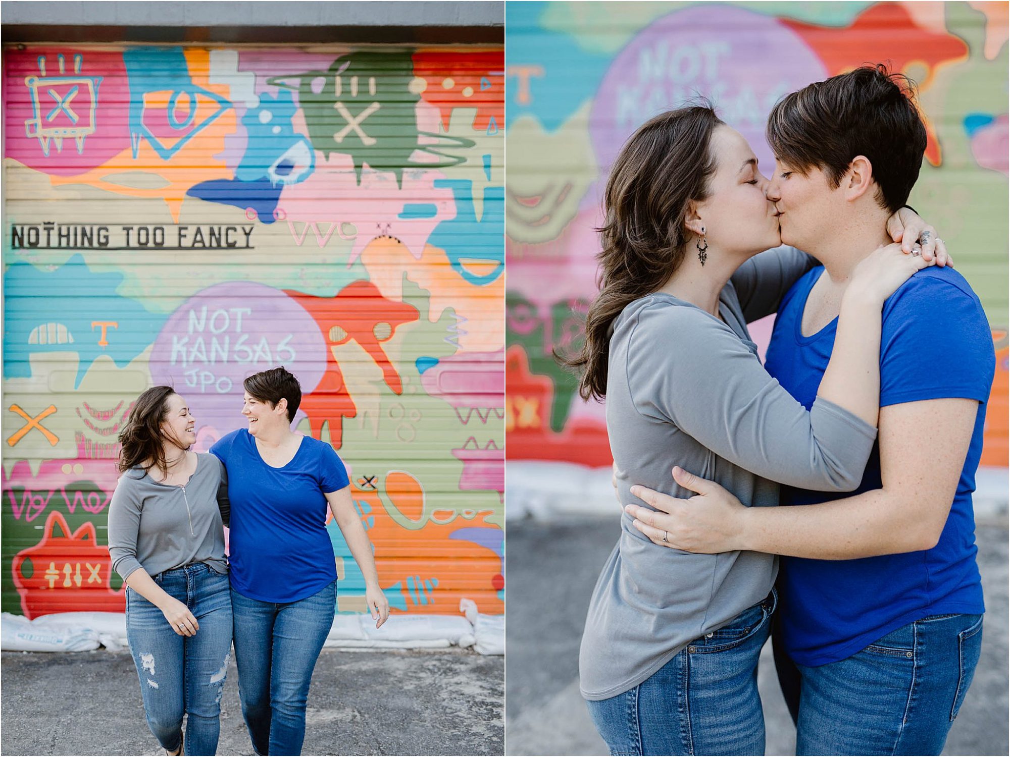 two women kissing in front of graffiti