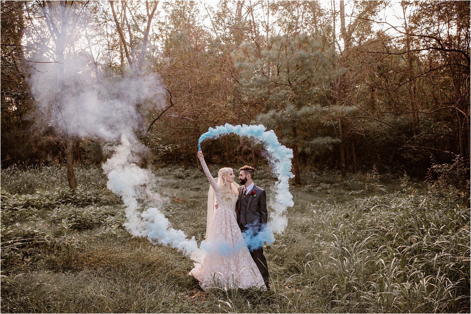 bride and groom with smoke bombs on wedding day