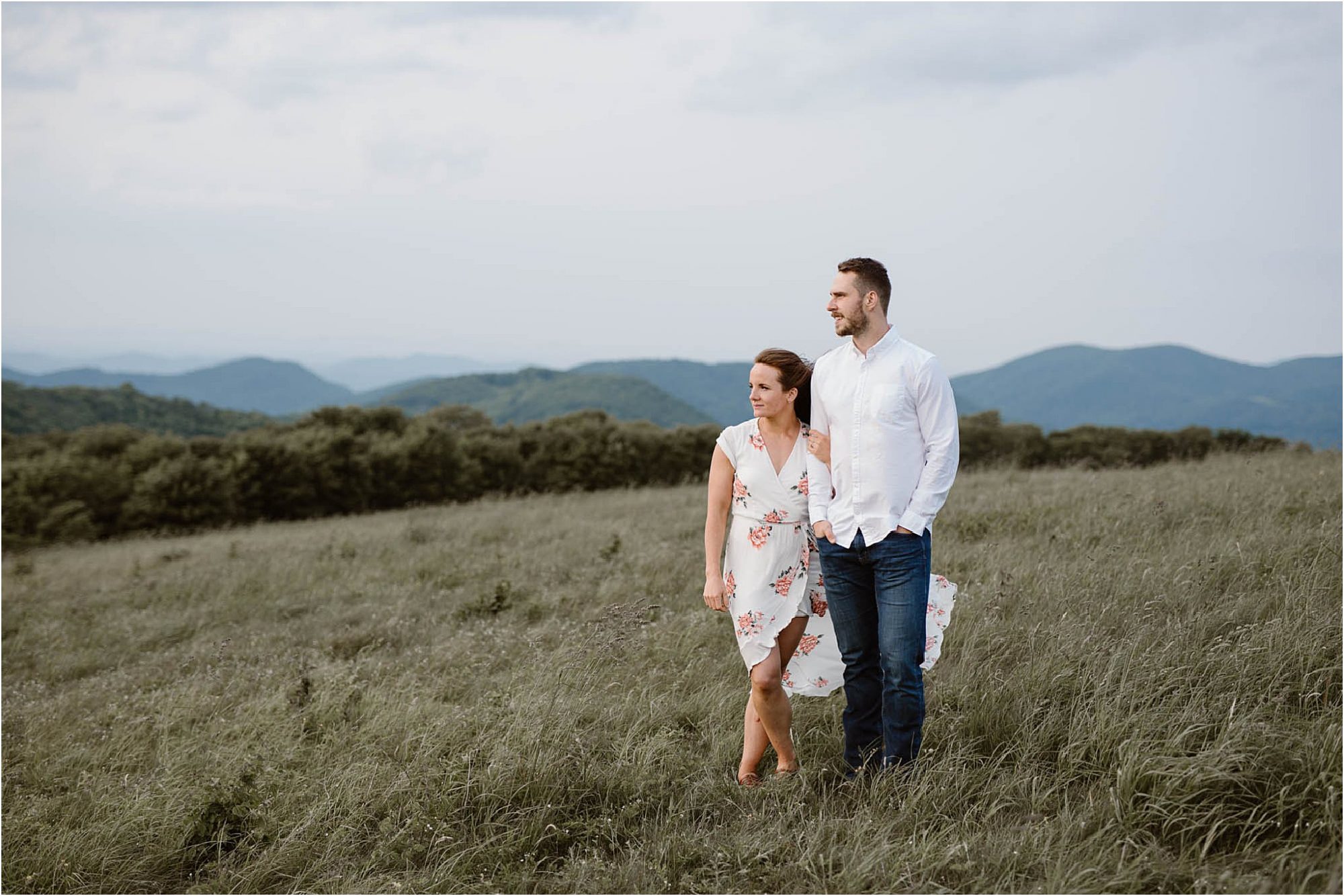 man and woman standing in field on top of Max Patch