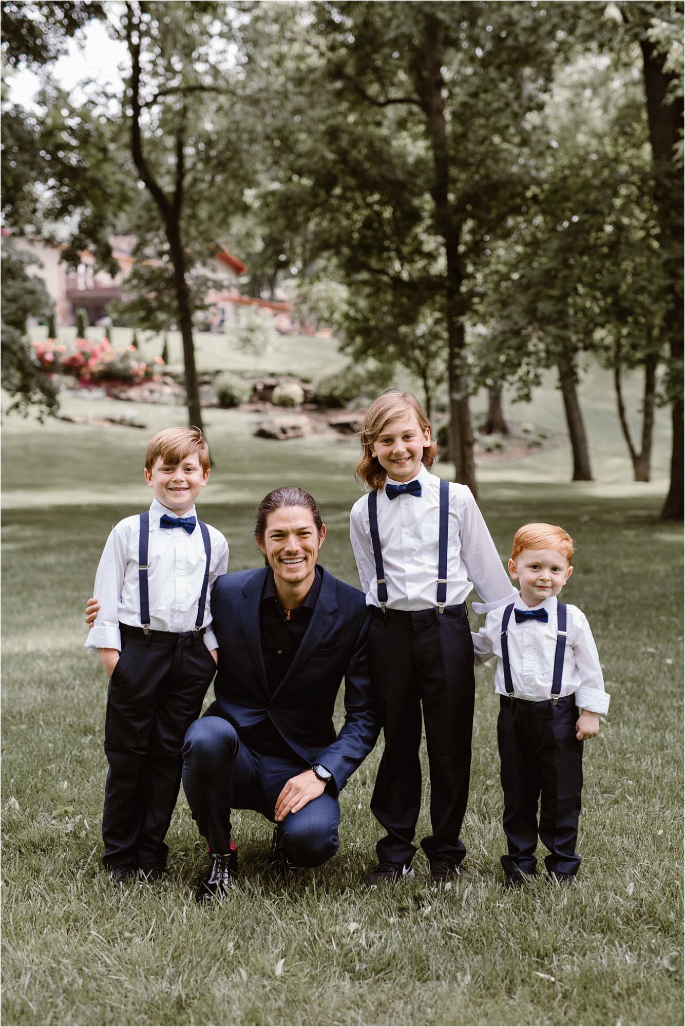 groom portrait with ring bearers