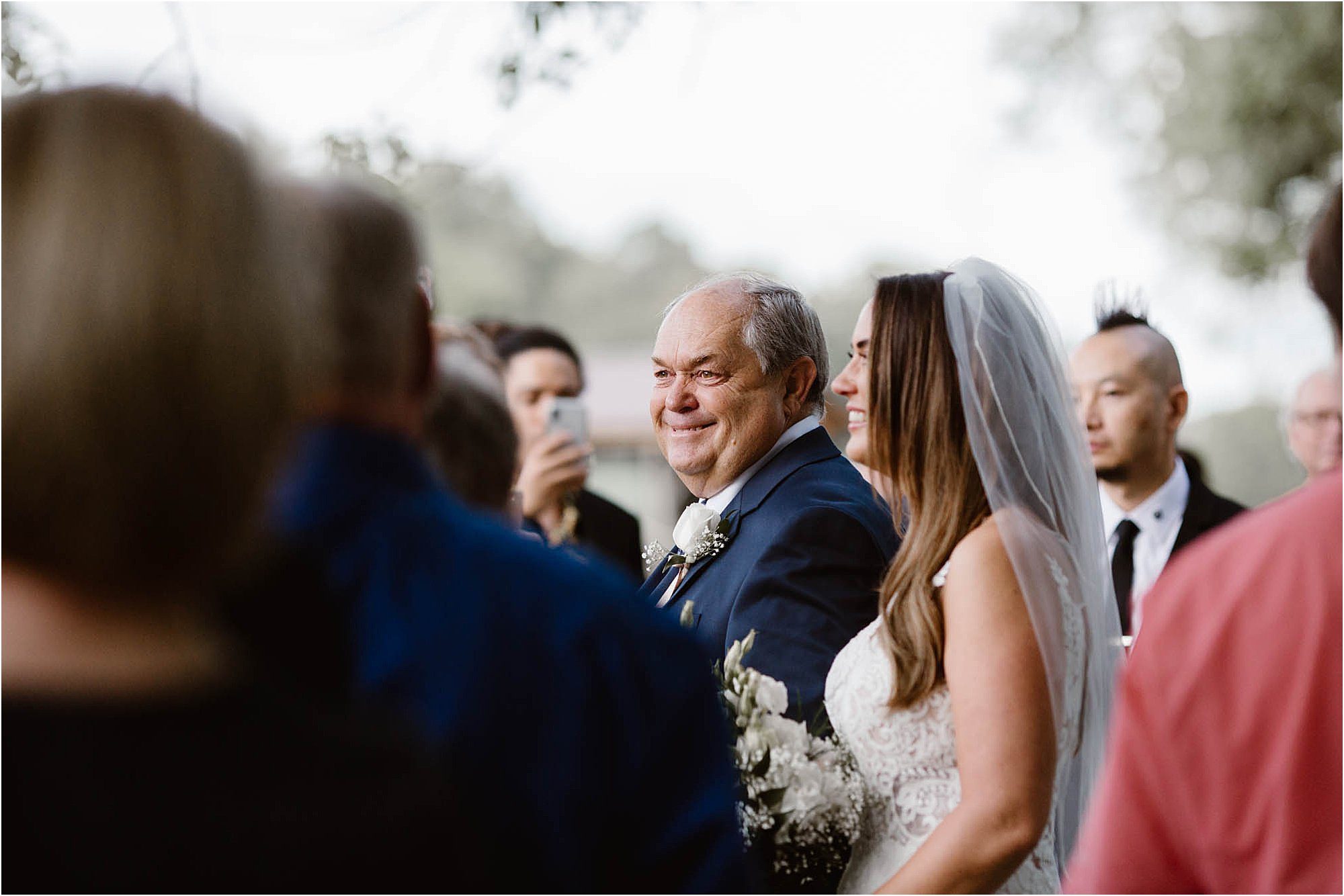 dad walking daughter down the aisle at backyard wedding ceremony