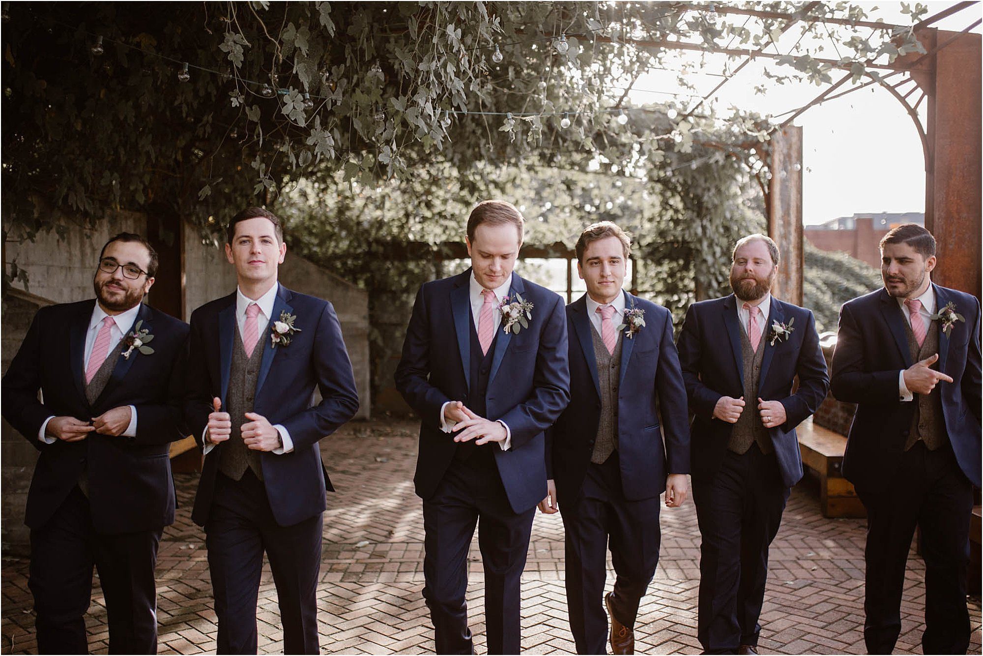 groom and groomsmen walking at The Standard