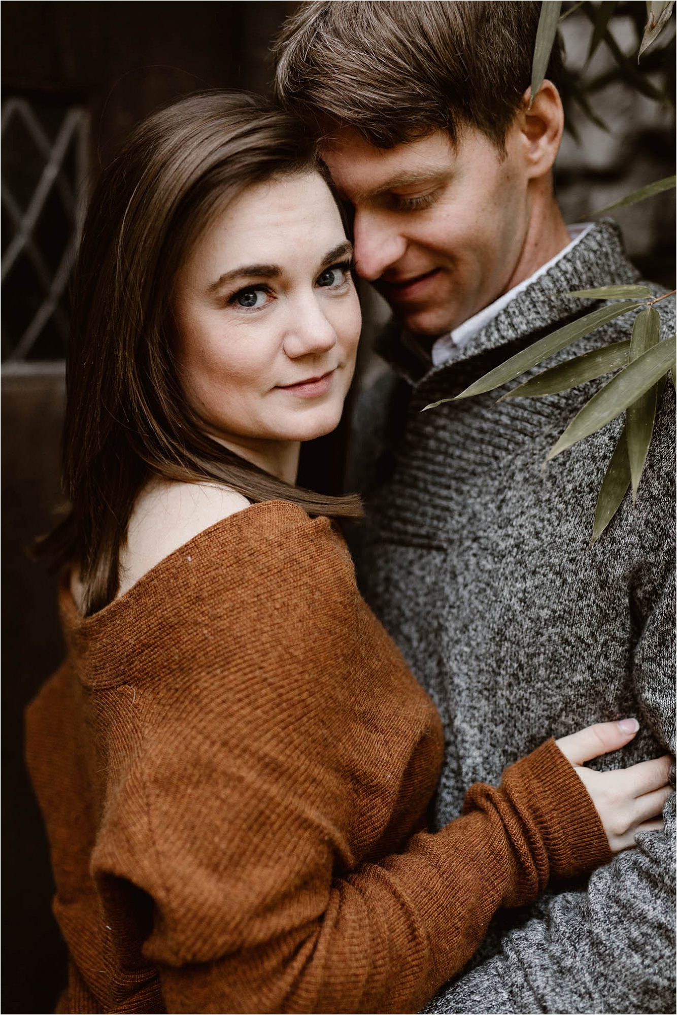 man and woman hugging at fall engagement photos