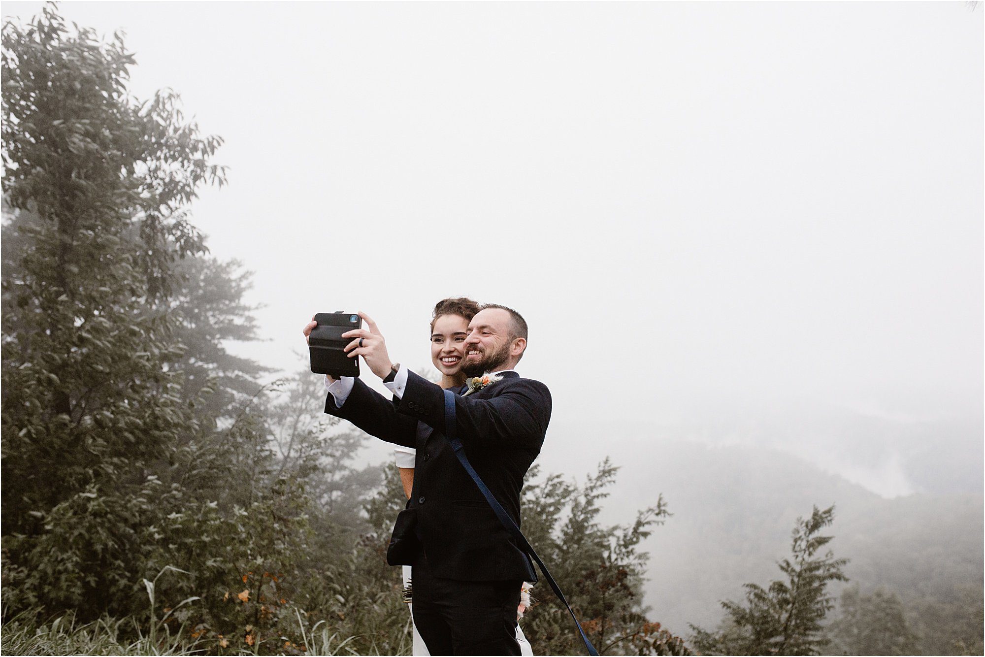 bride and groom selfie at the mountains