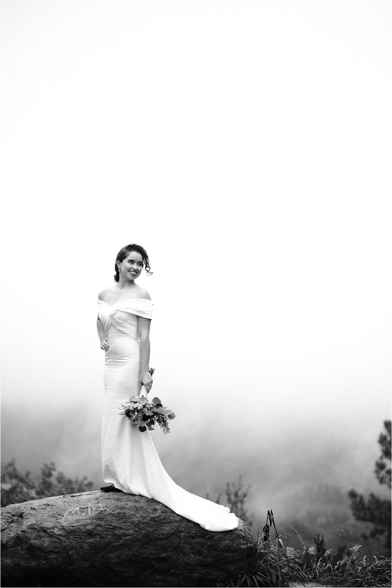 black and white photo of bride in the mountains