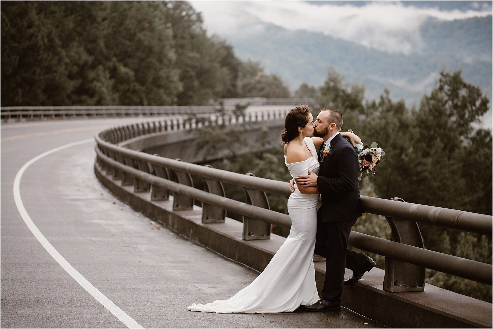 bride and groom kiss on the Foothills Parkway Missing Link