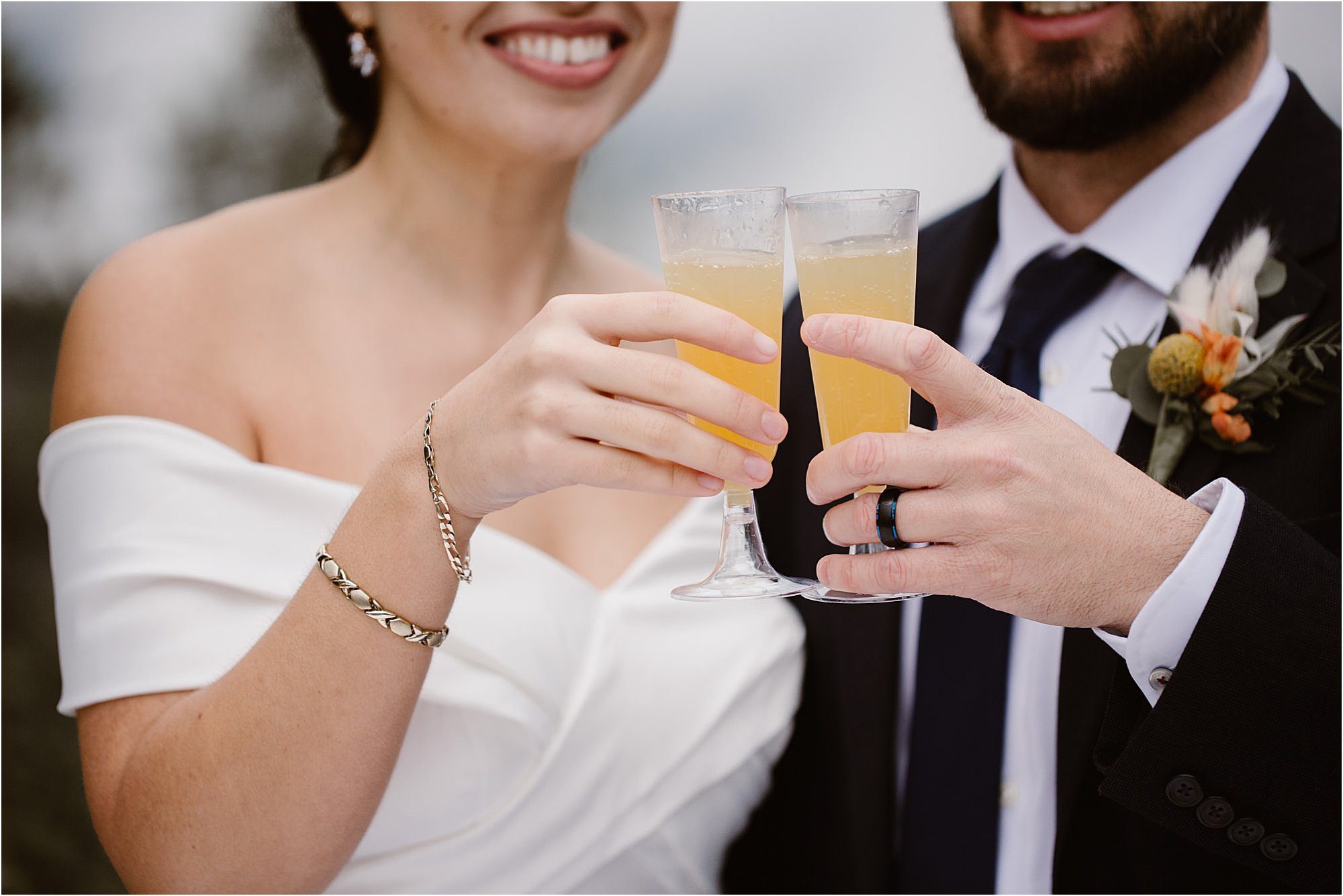 bride and groom cheers at elopement