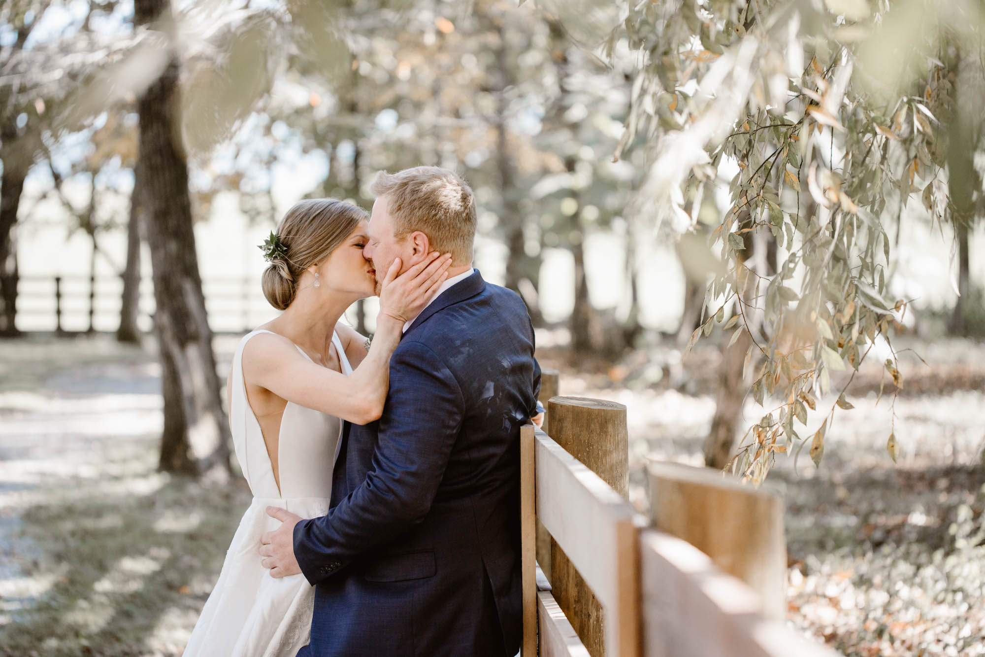 bride and groom kissing at Riverview Family Farm