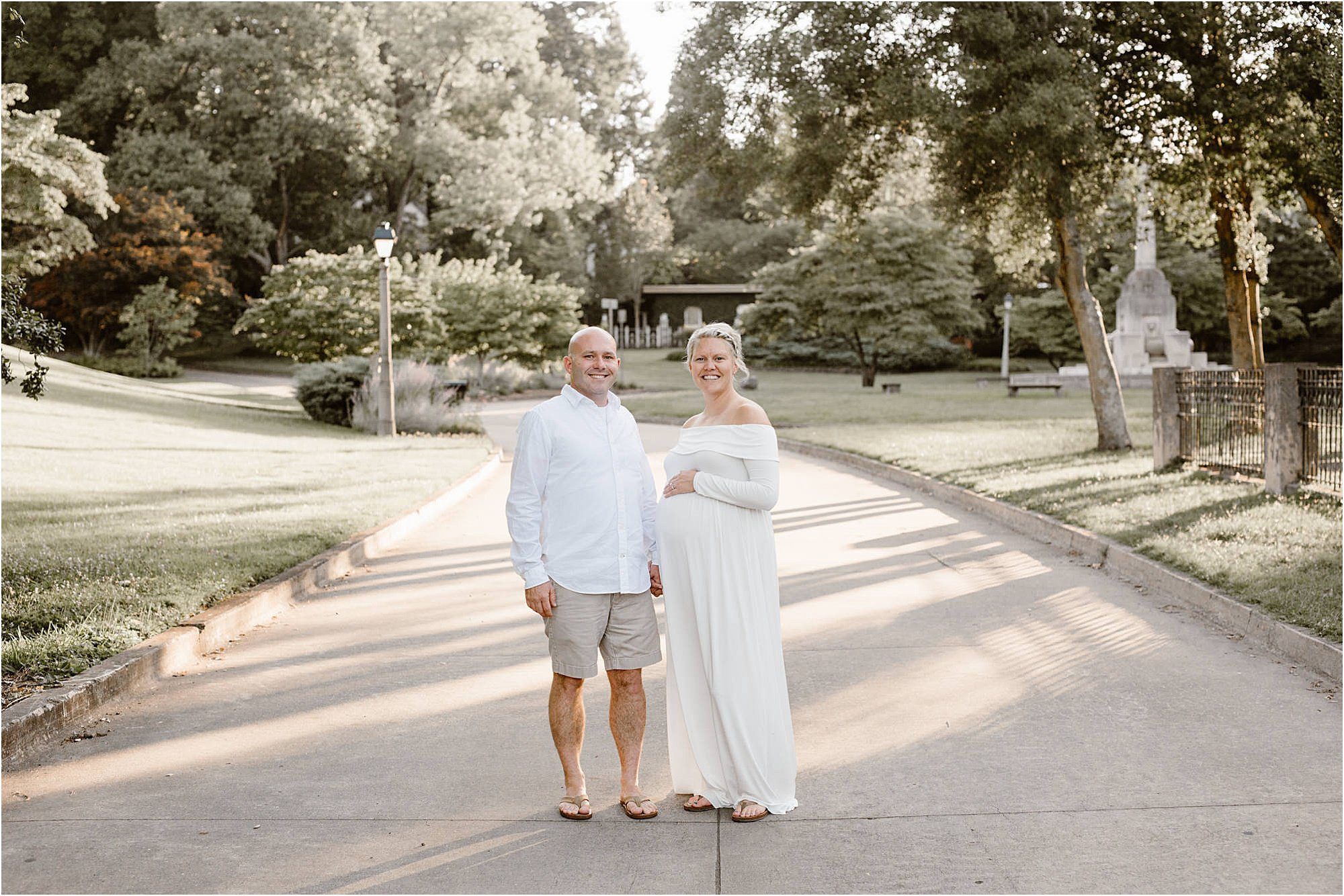 maternity photos with man and woman in white