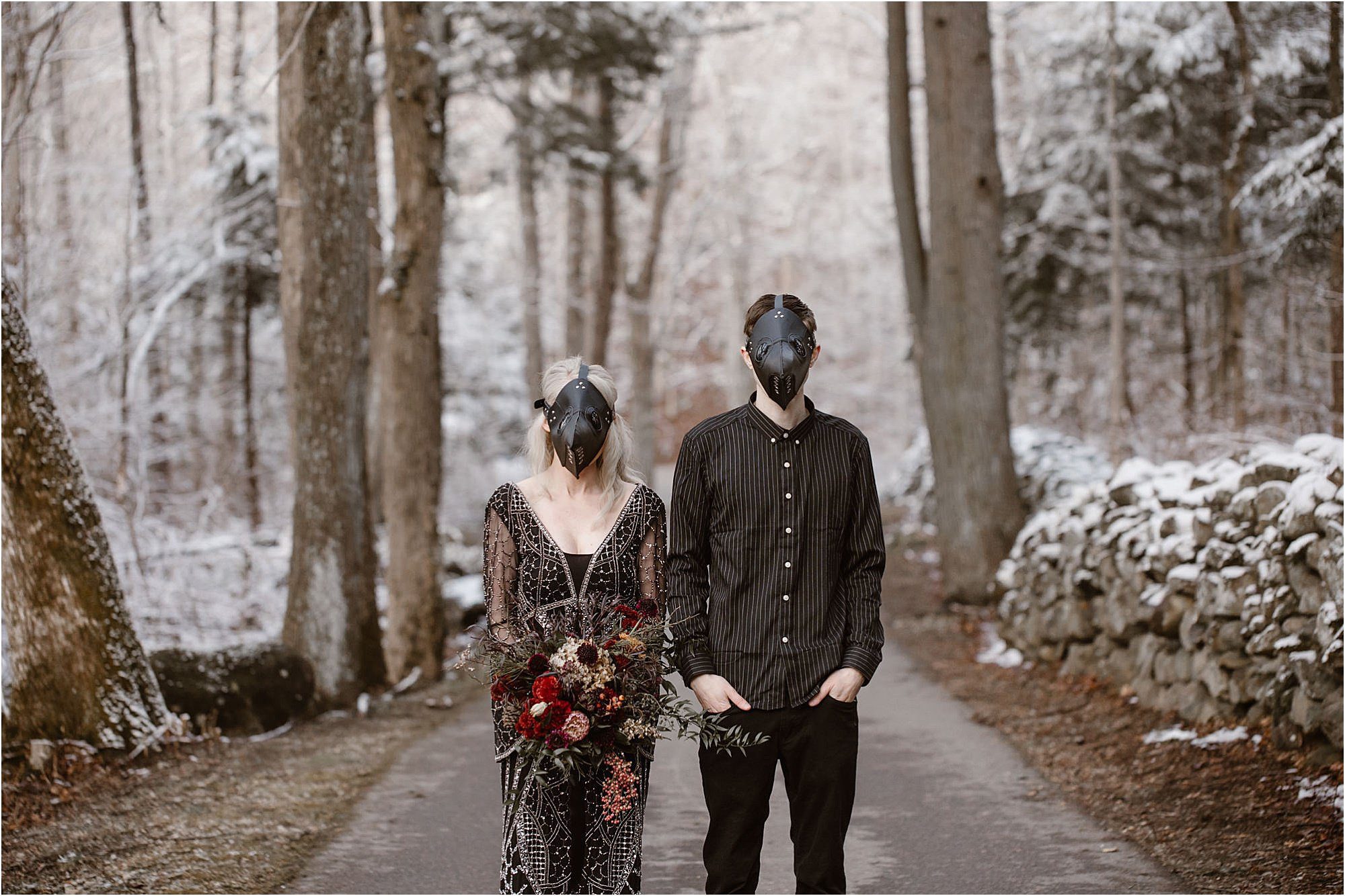 engagement photos with bride and groom in black plague masks