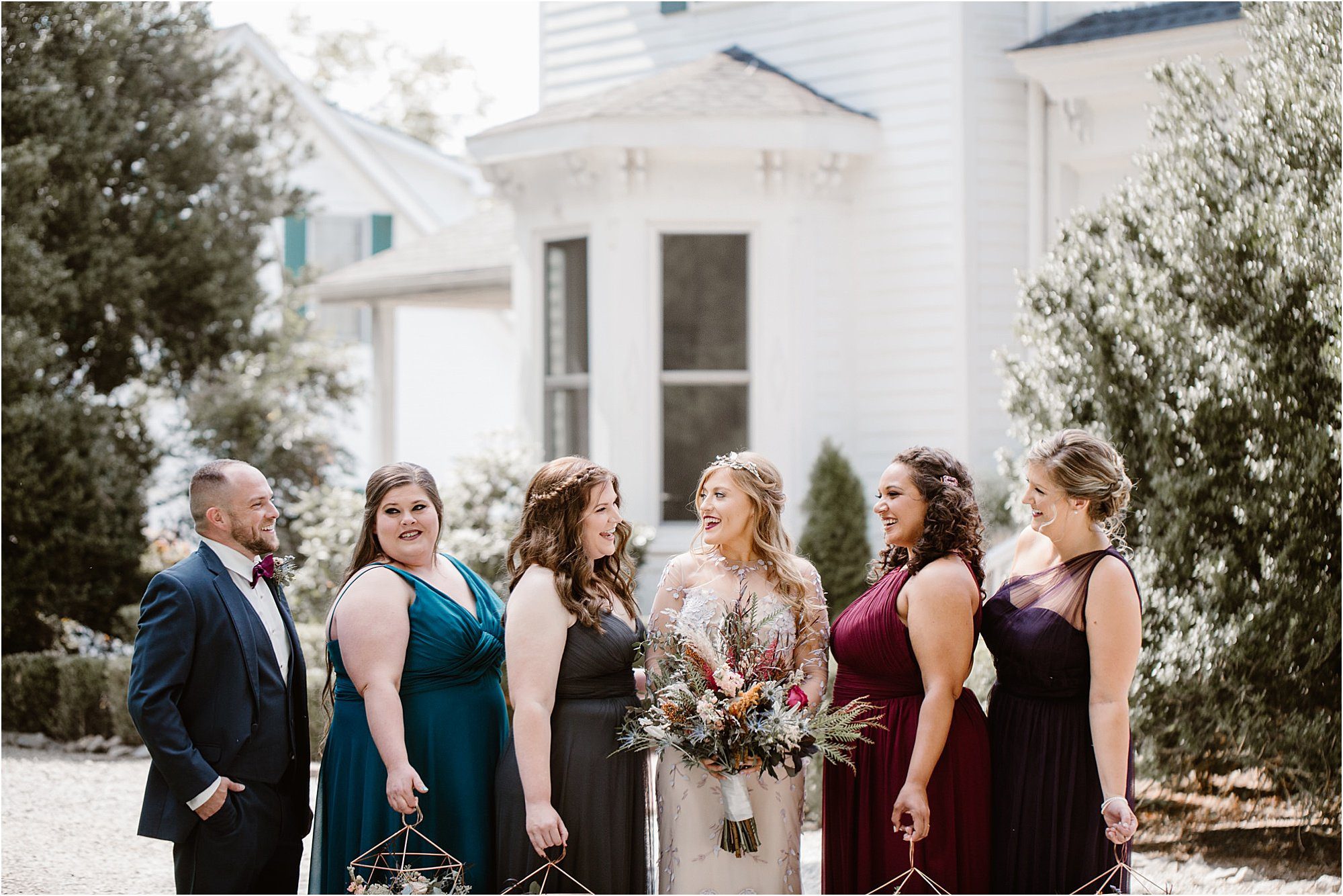 wedding party in jewel-toned outfits