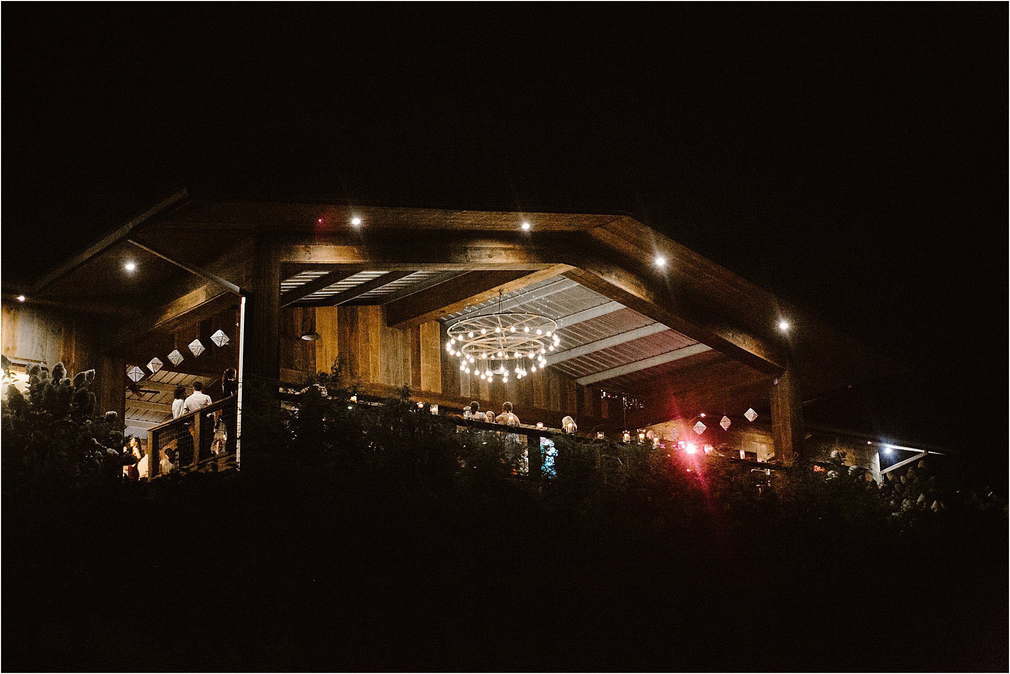 night photo of wedding reception at The Vineyards at Betty's Creek
