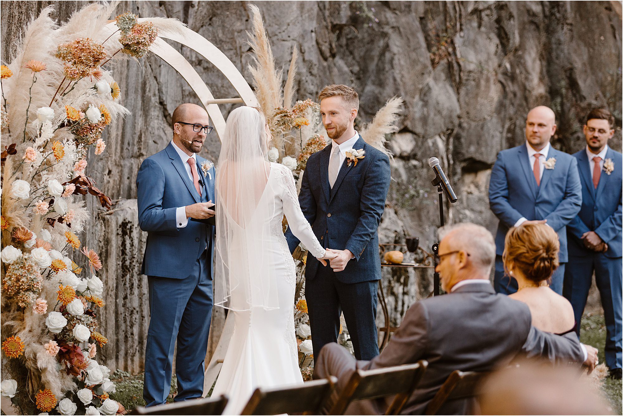 groom and bride say vows at autumnal wedding in Knoxville
