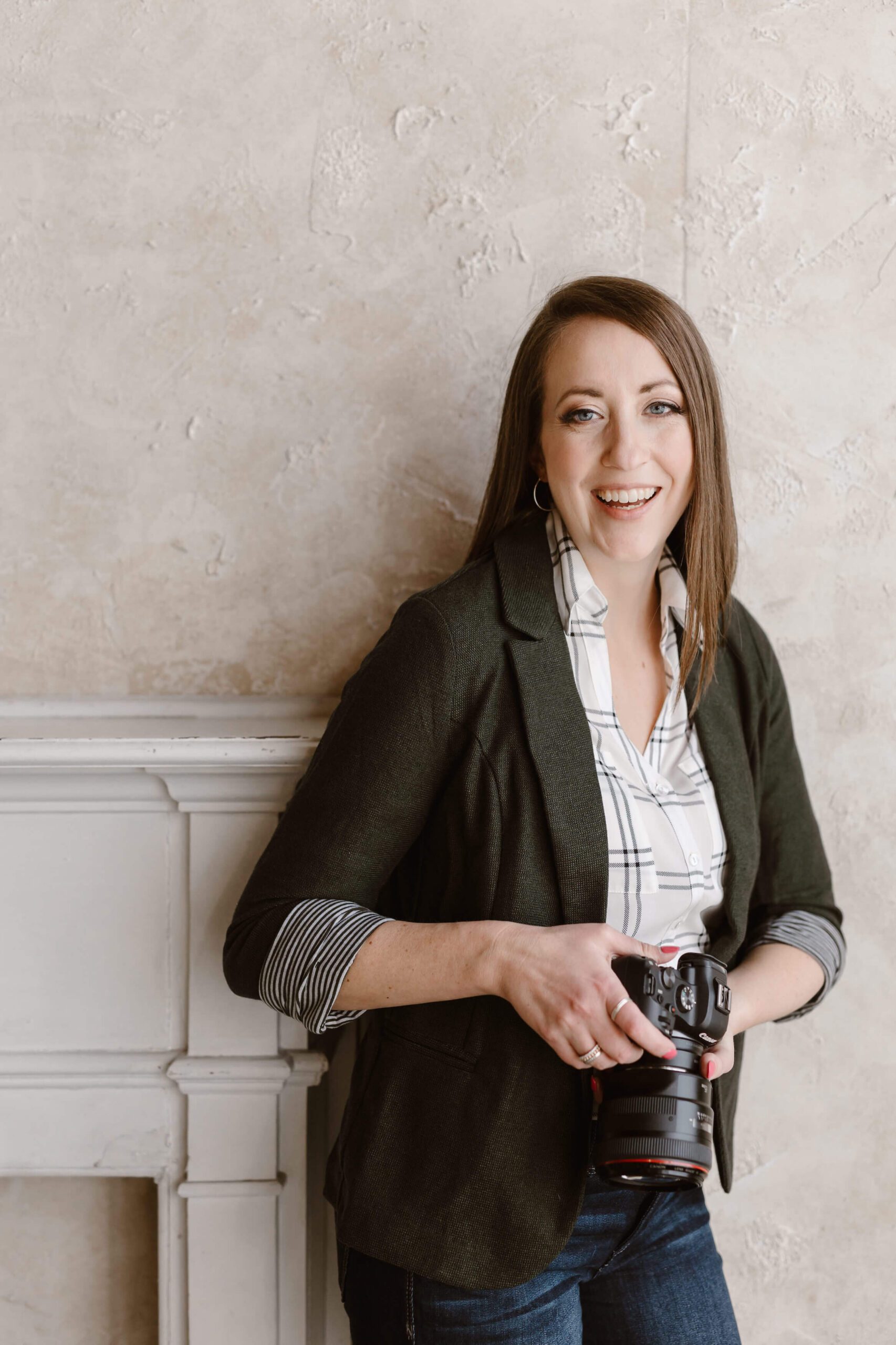 Erin Morrison laughing while holding camera about this Knoxville Wedding Photographer