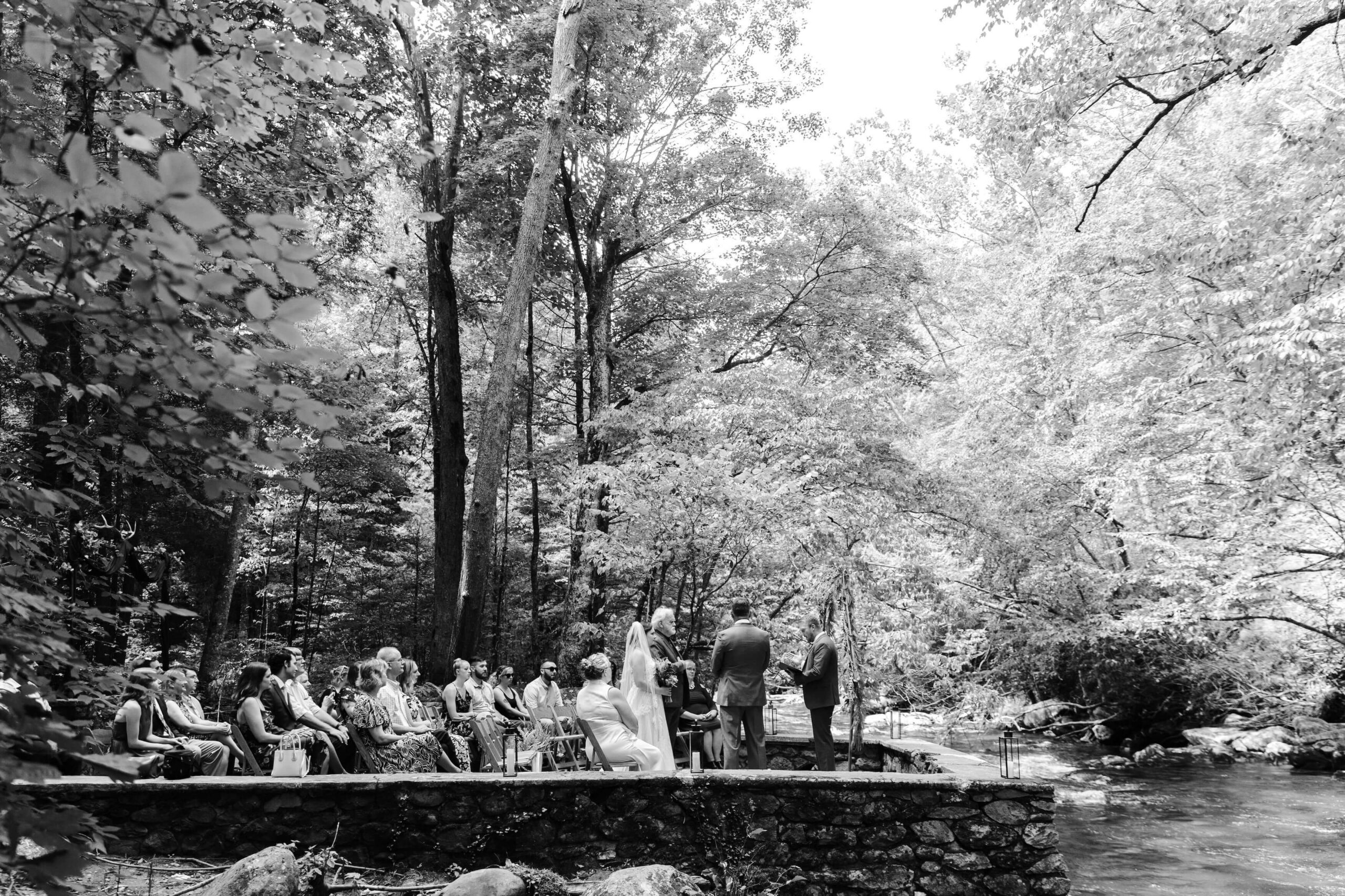 black and white elopement ceremony photo overlooking the Little River in the Smokies