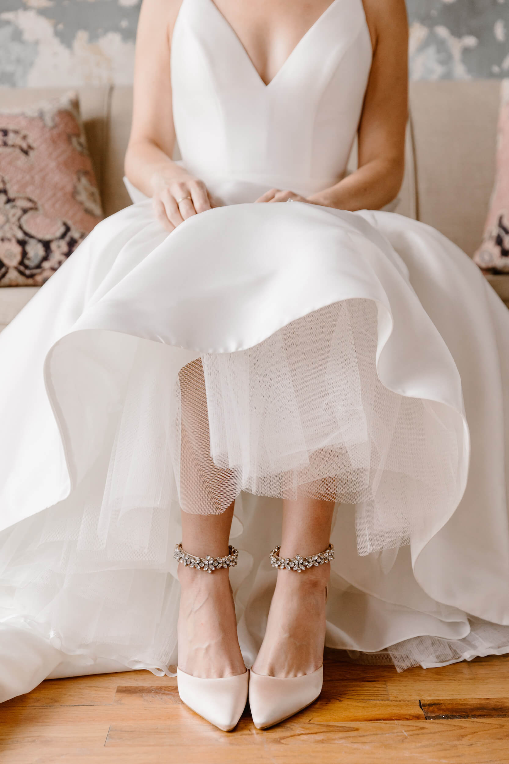 bride in white wedding dress with white and silver shoes