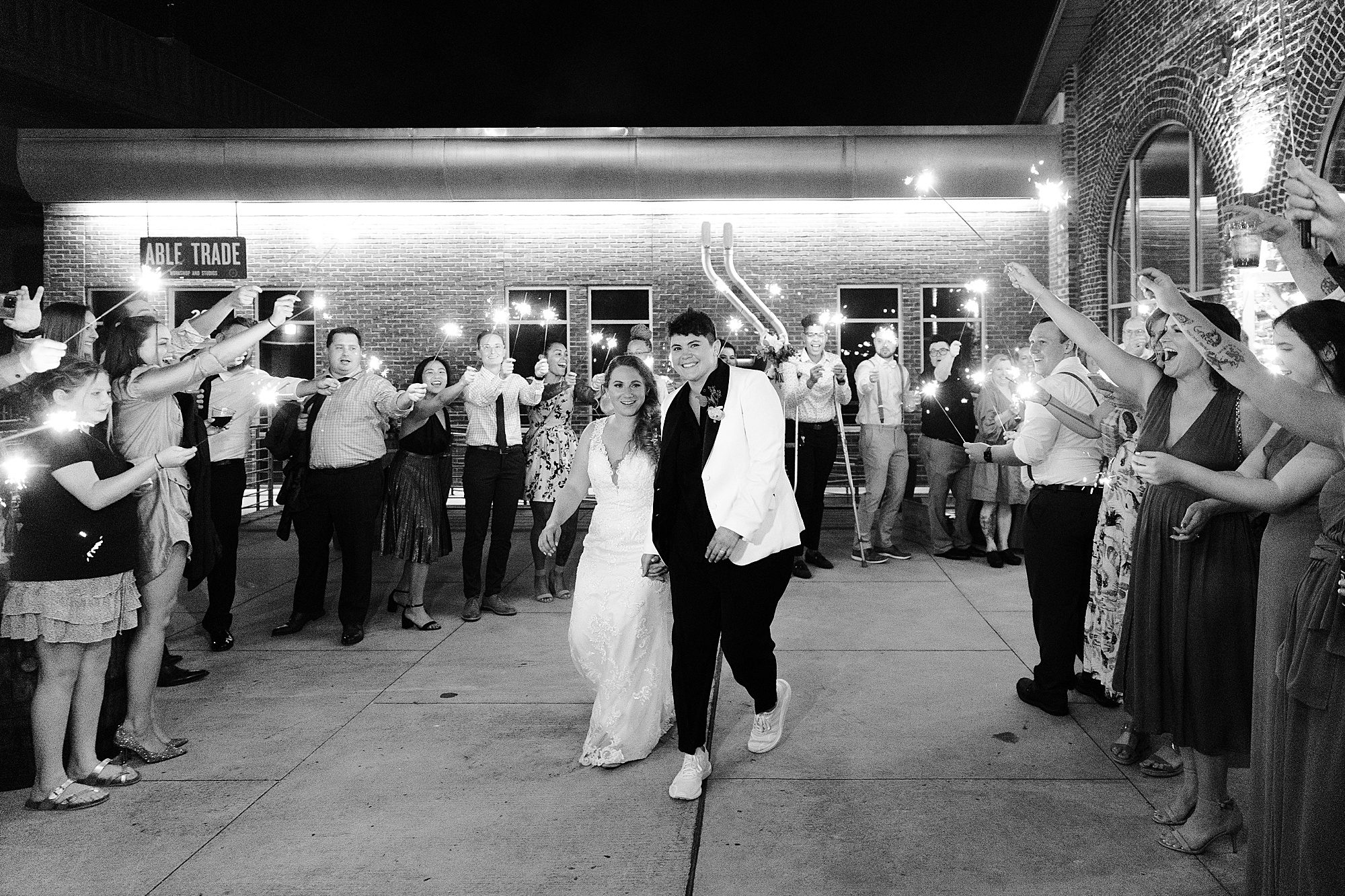 wedding couple exits wedding with sparklers
