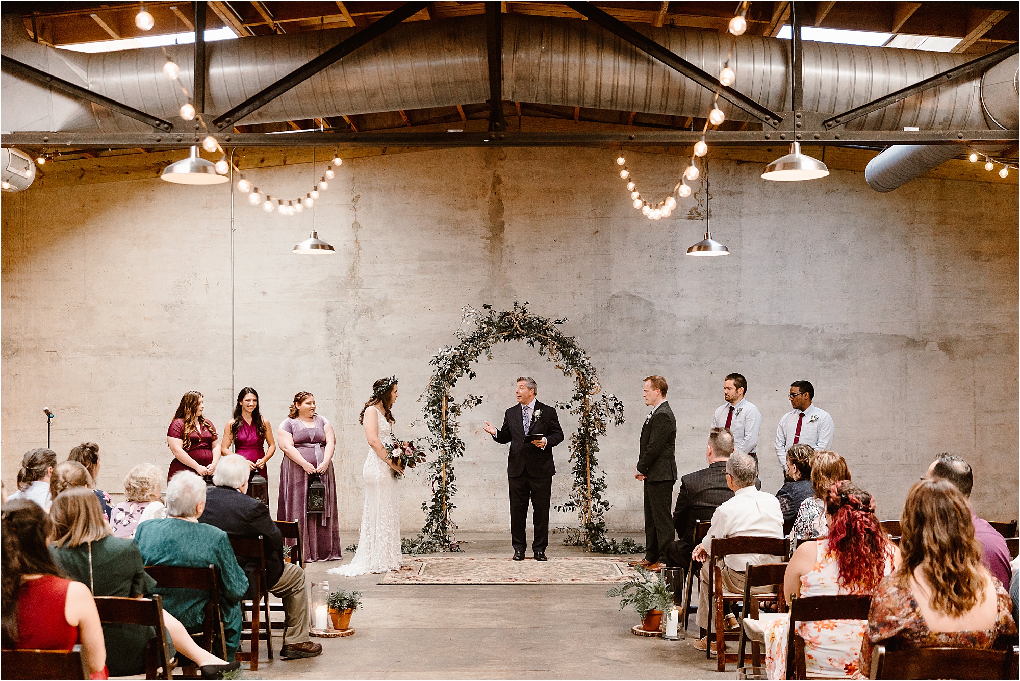 delightful wedding at The Standard Knoxville with greenery arbor