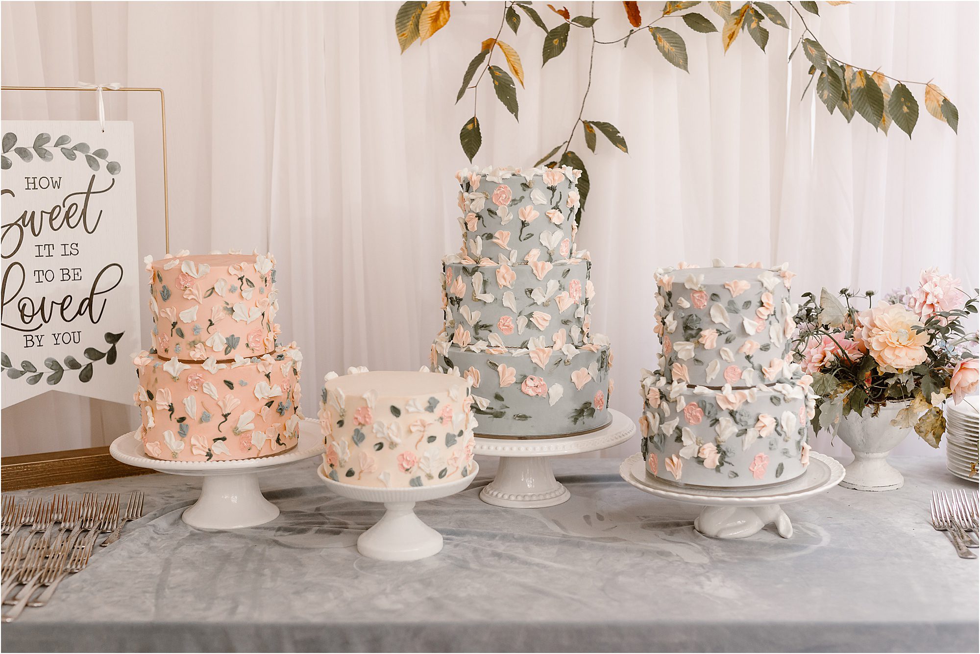 impeccable floral wedding cakes in blue and pink